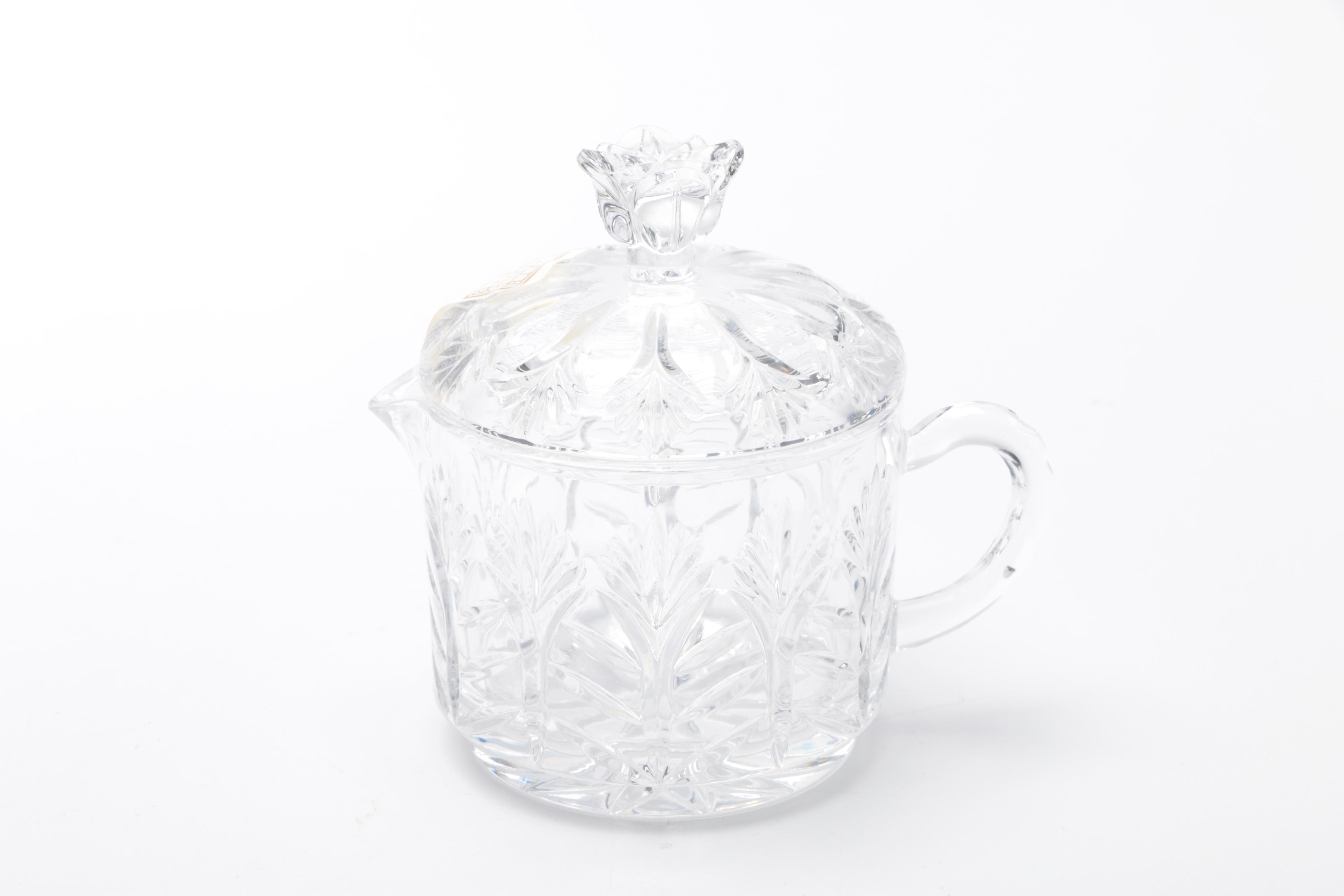 Generous Assortment of Crystal Pieces and Tableware