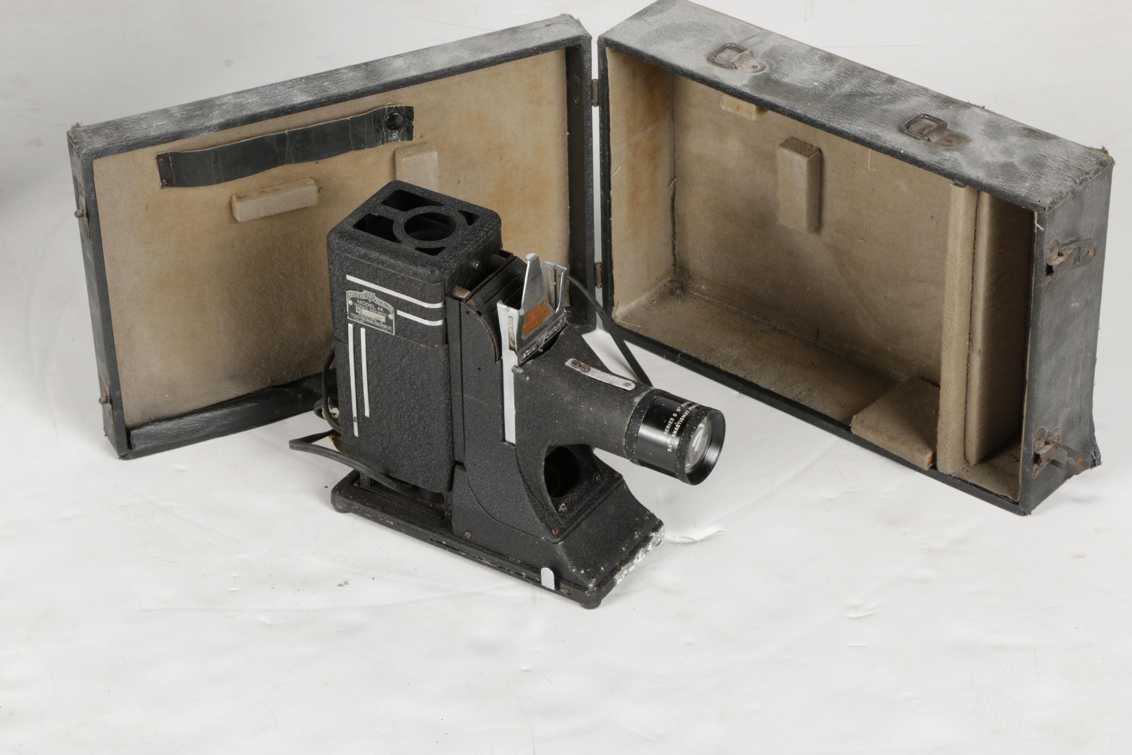 Four Vintage Projectors with Carrying Cases including Bell & Howell