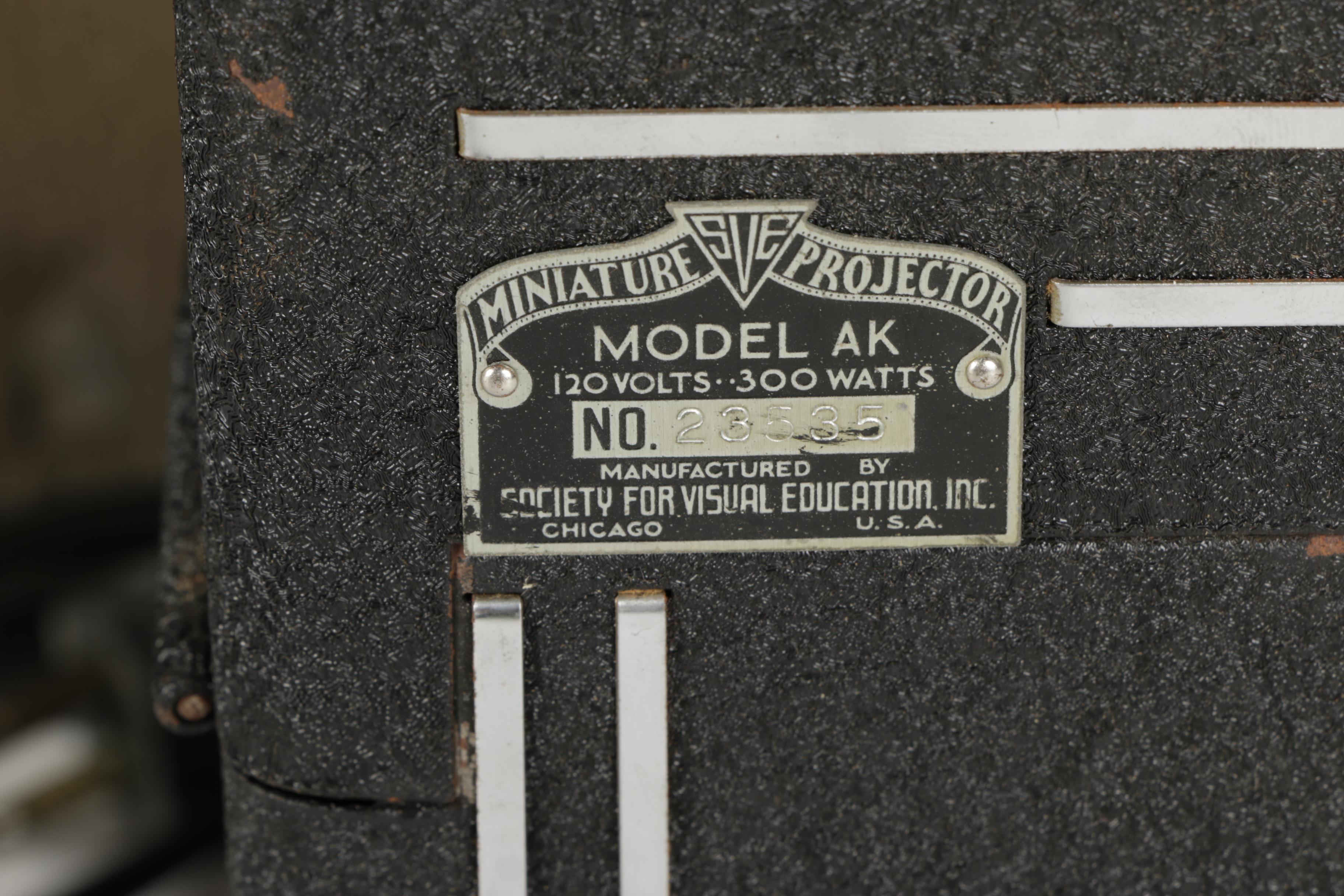 Four Vintage Projectors with Carrying Cases including Bell & Howell