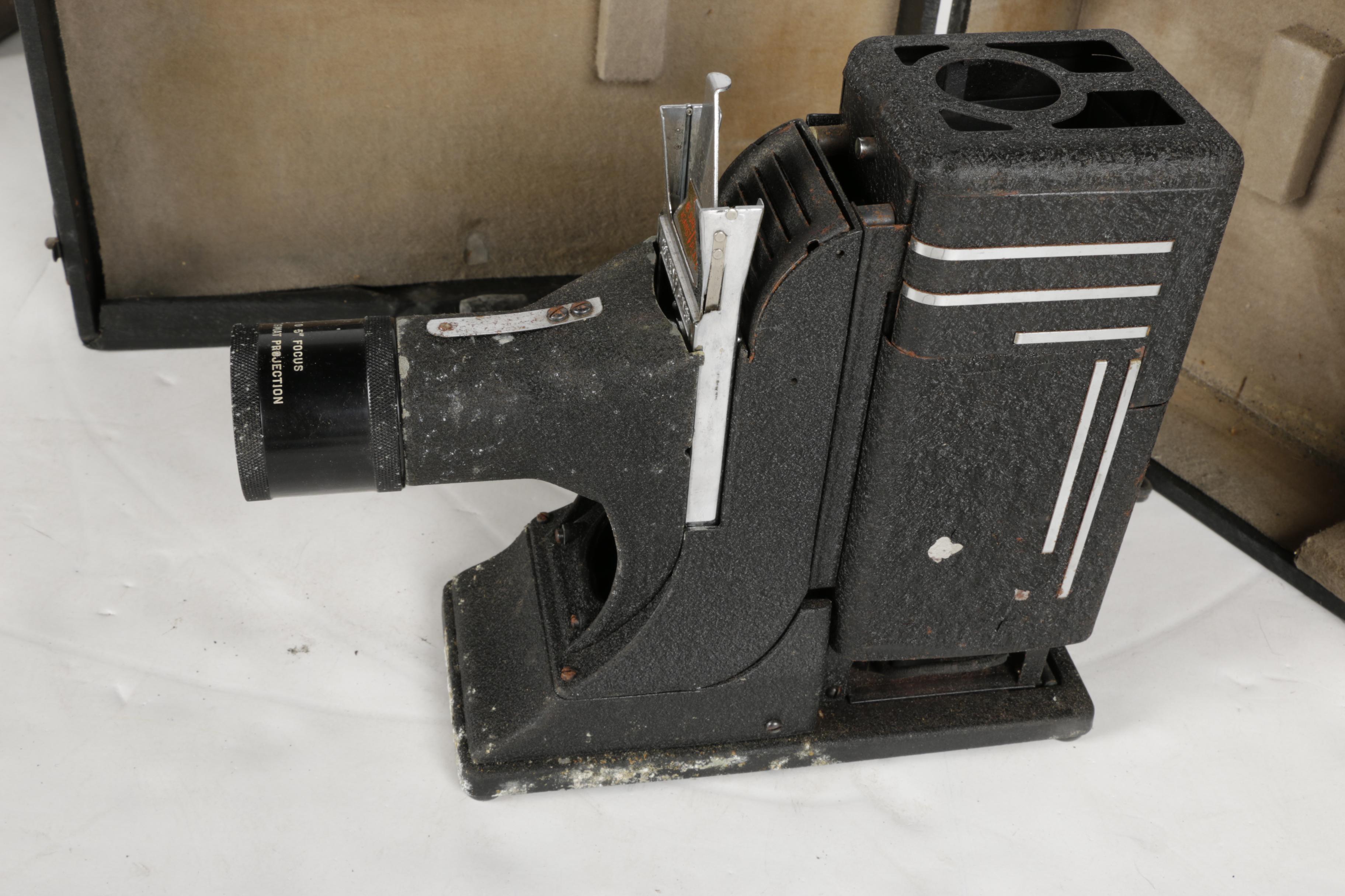 Four Vintage Projectors with Carrying Cases including Bell & Howell