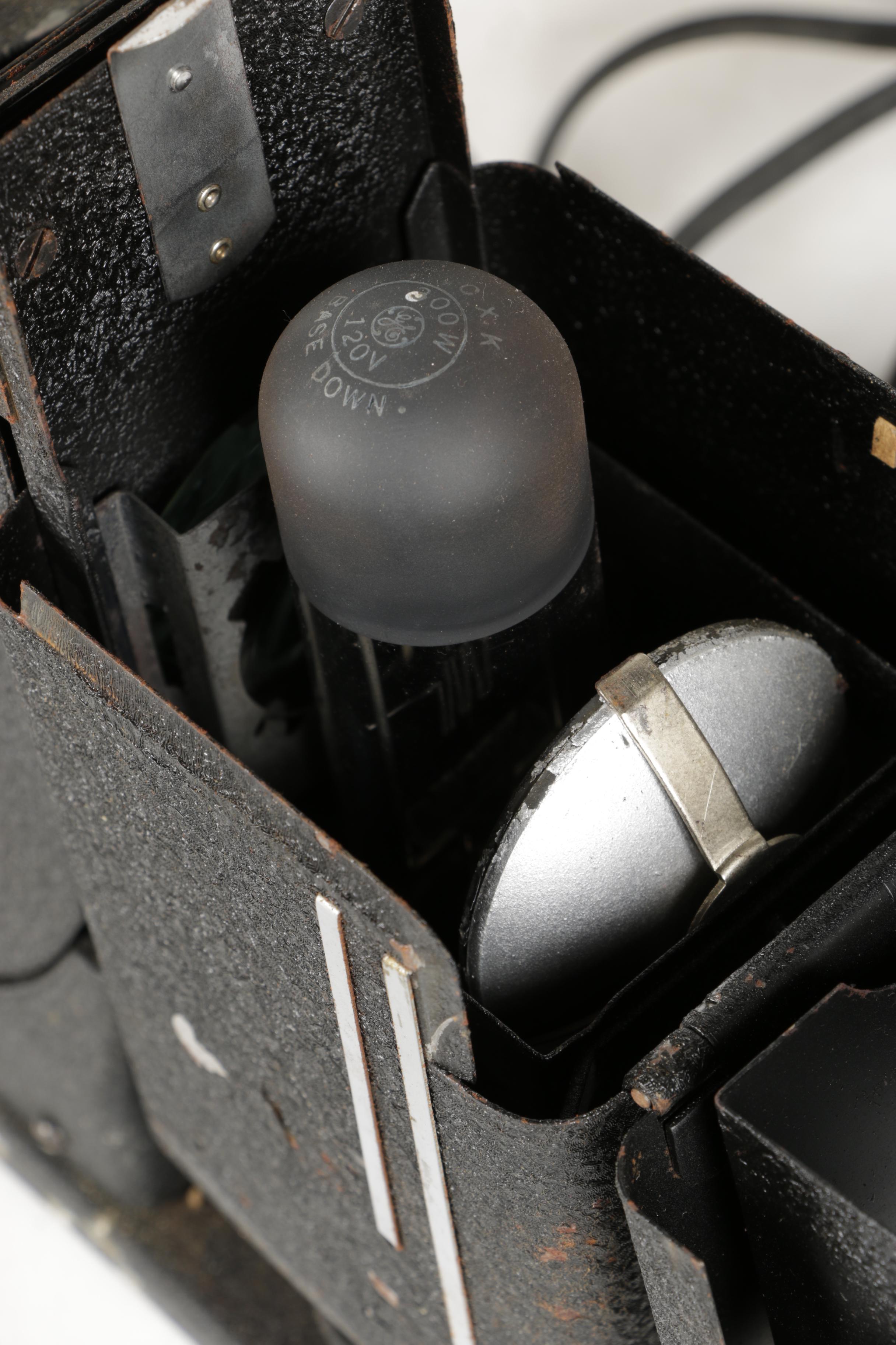 Four Vintage Projectors with Carrying Cases including Bell & Howell