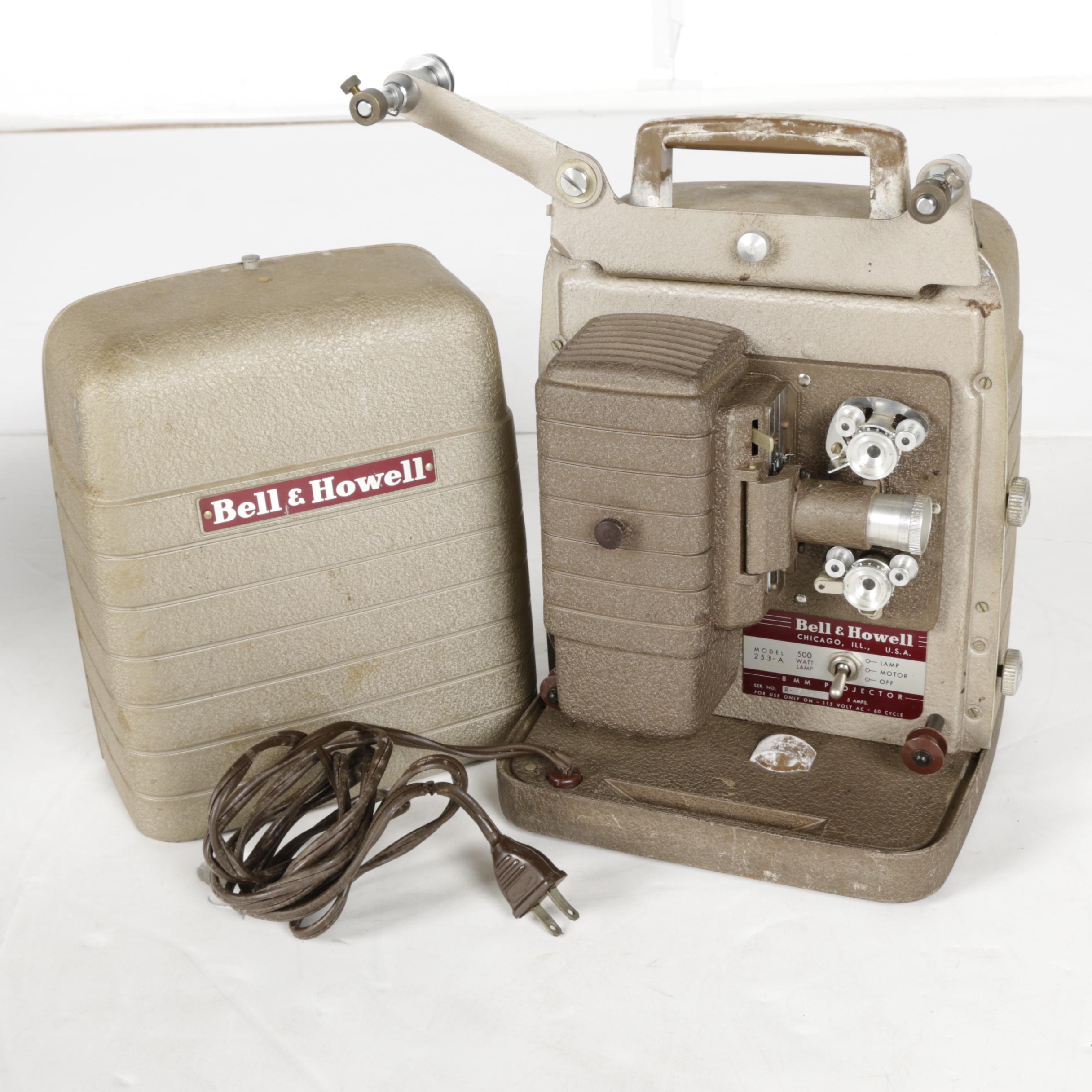 Four Vintage Projectors with Carrying Cases including Bell & Howell