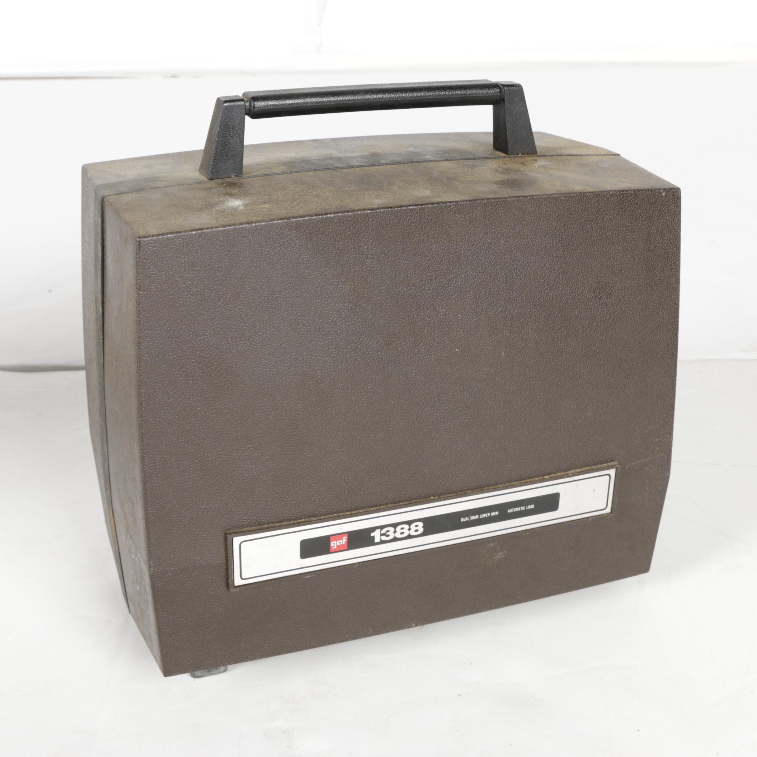 Four Vintage Projectors with Carrying Cases including Bell & Howell