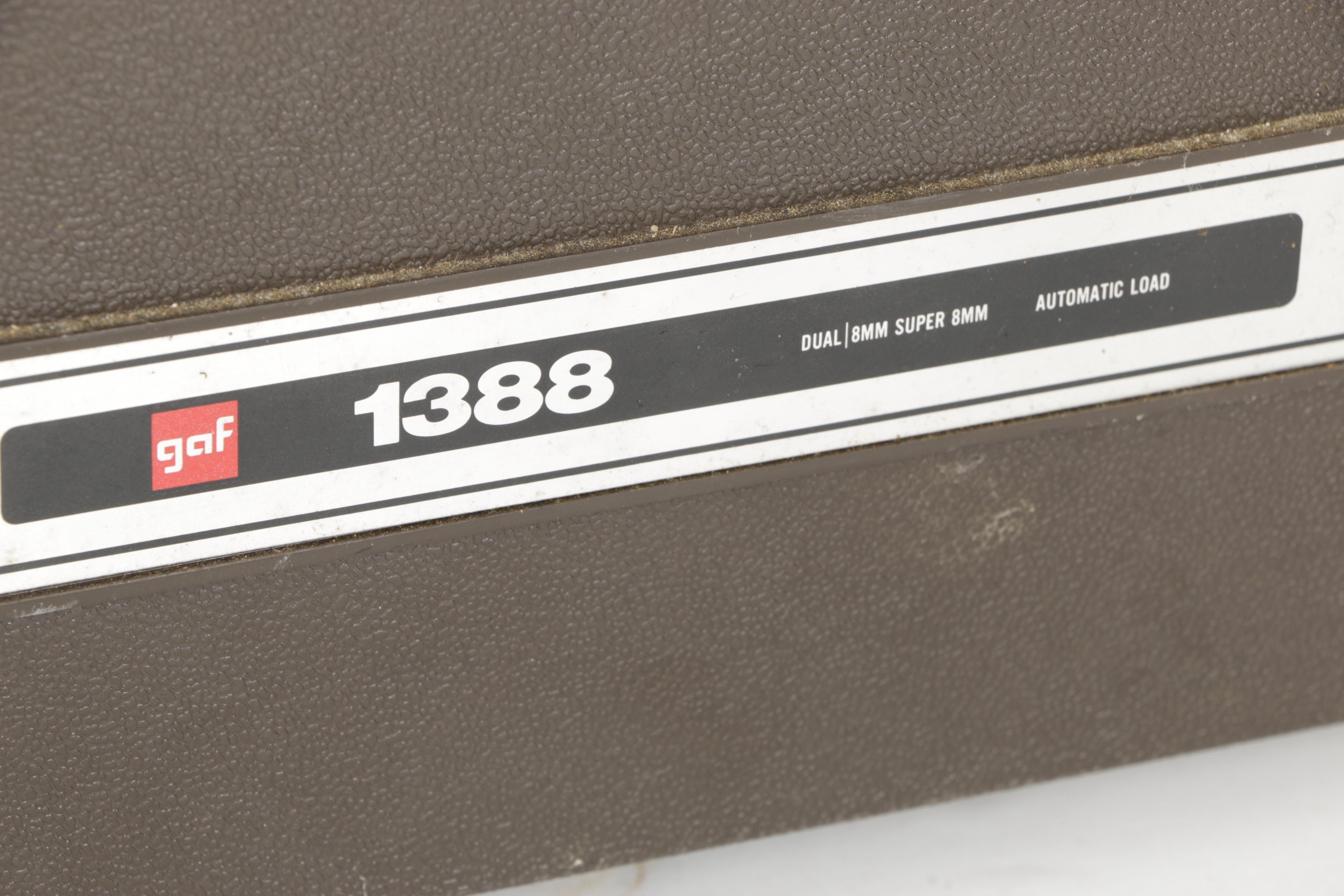 Four Vintage Projectors with Carrying Cases including Bell & Howell