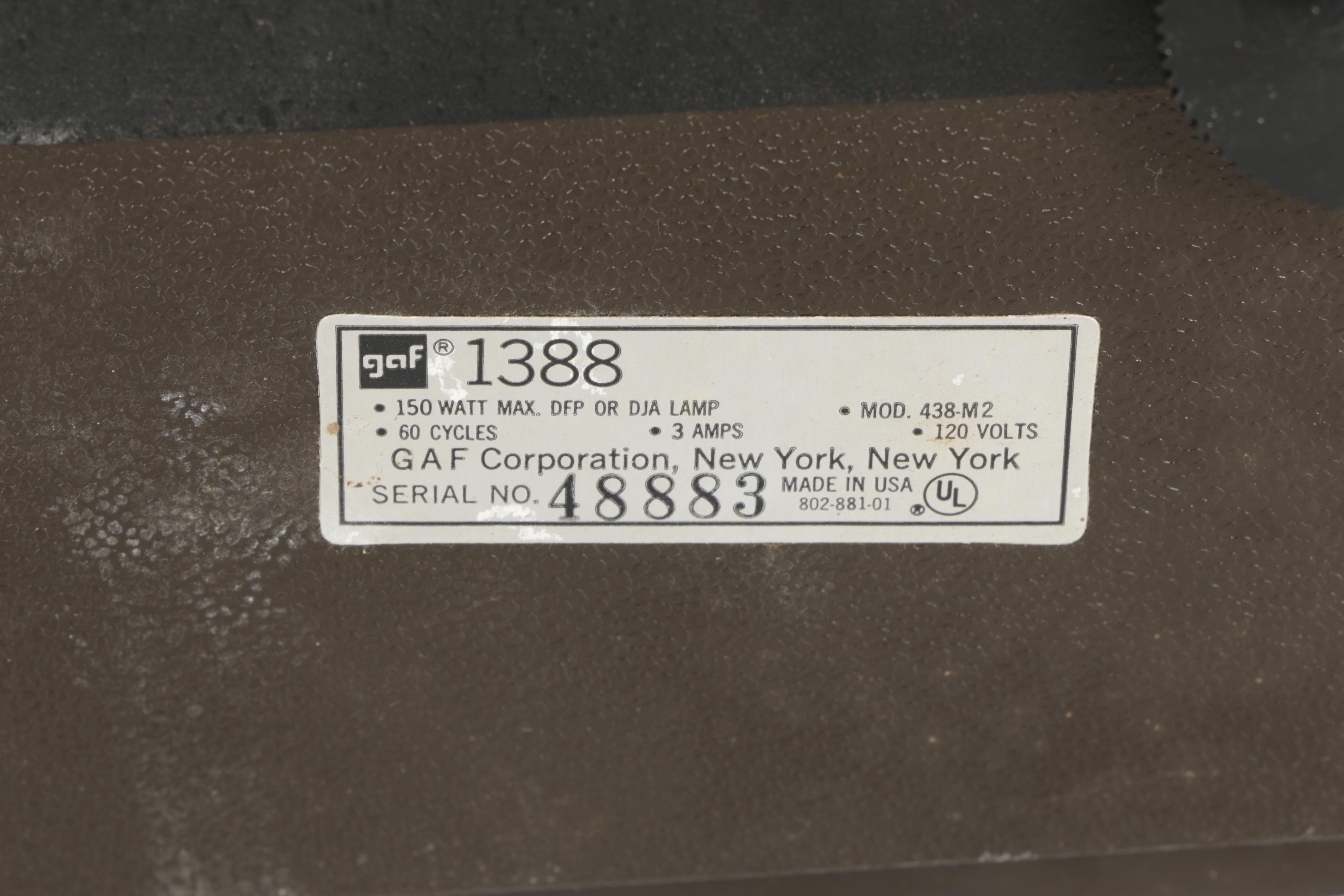 Four Vintage Projectors with Carrying Cases including Bell & Howell