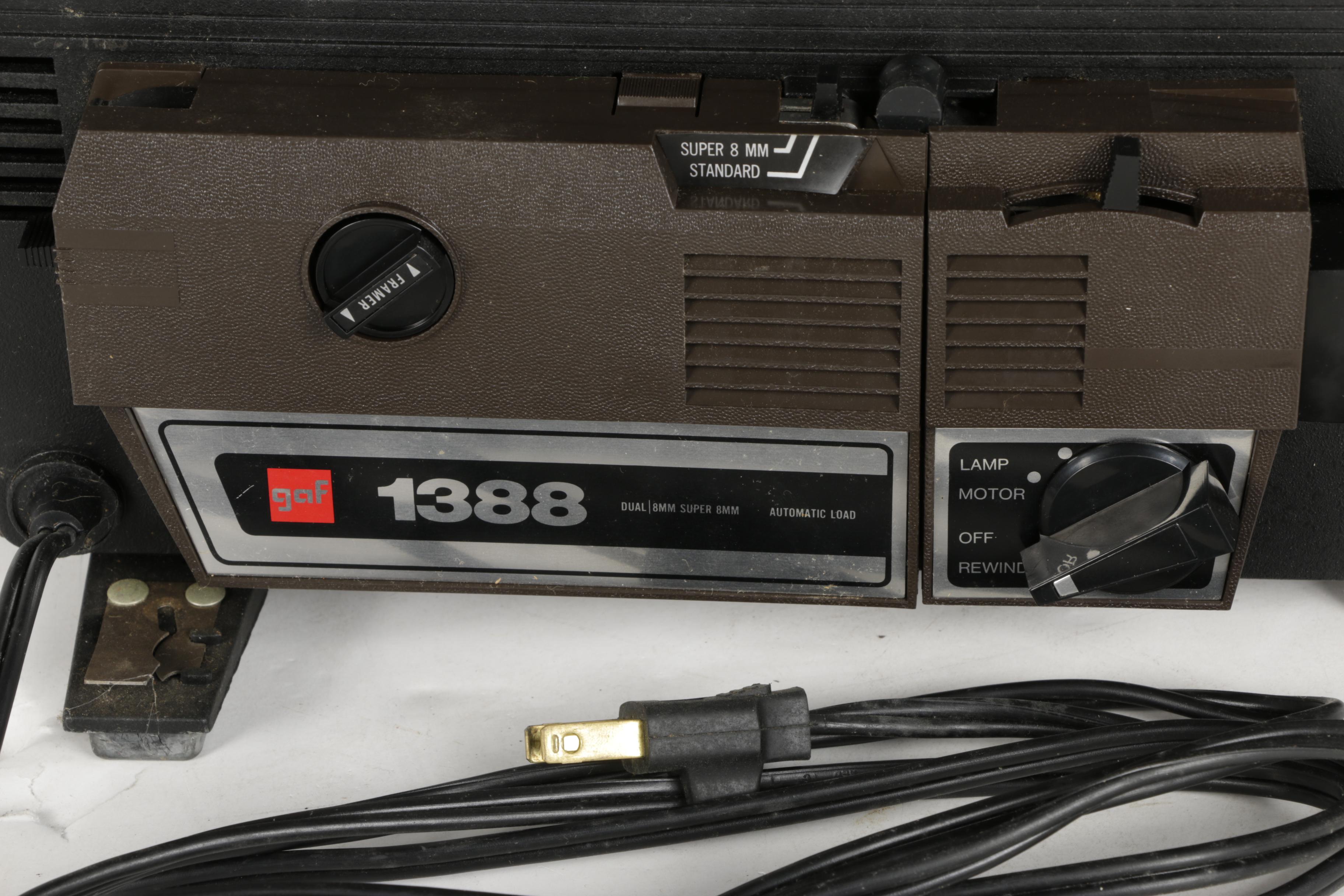 Four Vintage Projectors with Carrying Cases including Bell & Howell