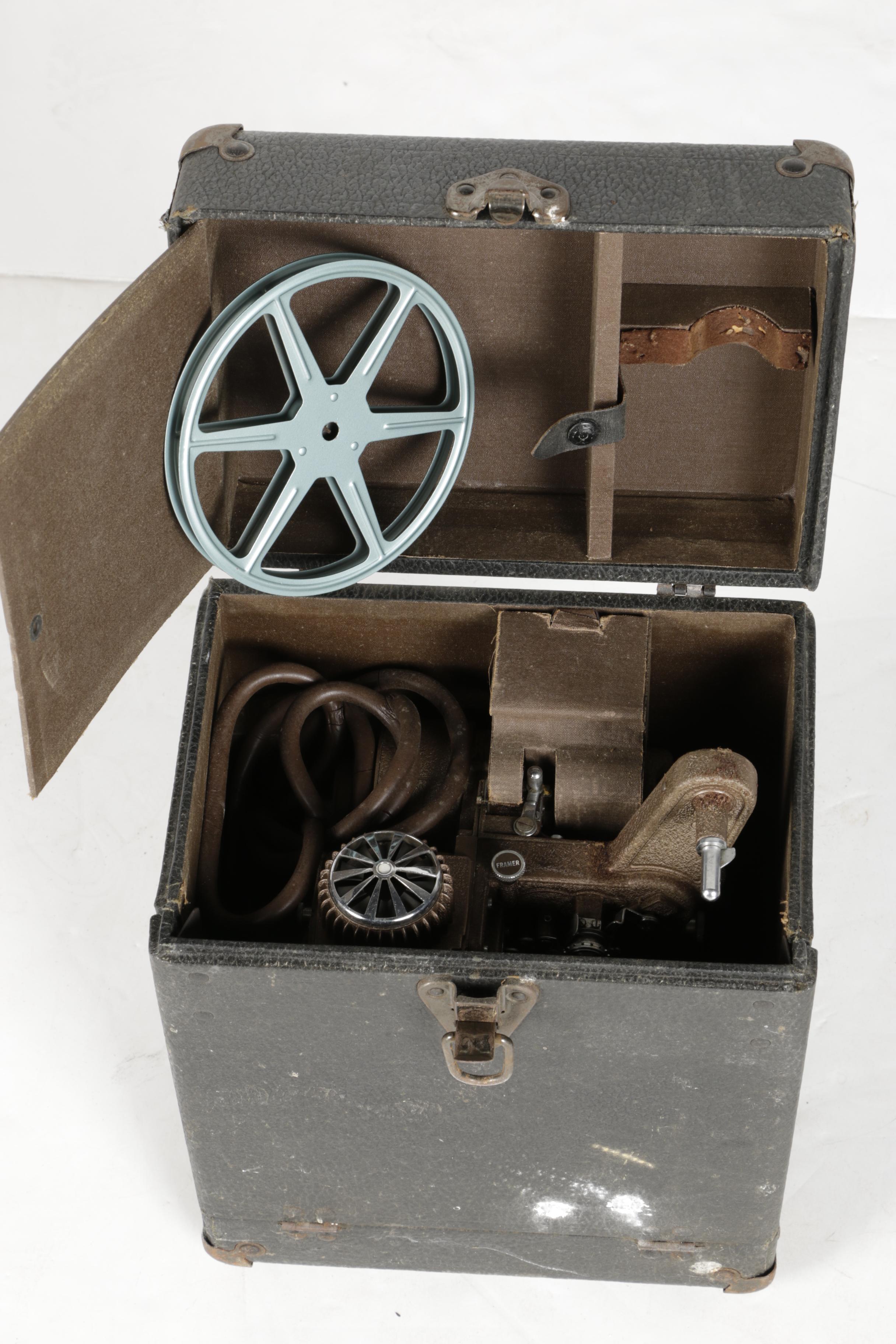 Four Vintage Projectors with Carrying Cases including Bell & Howell