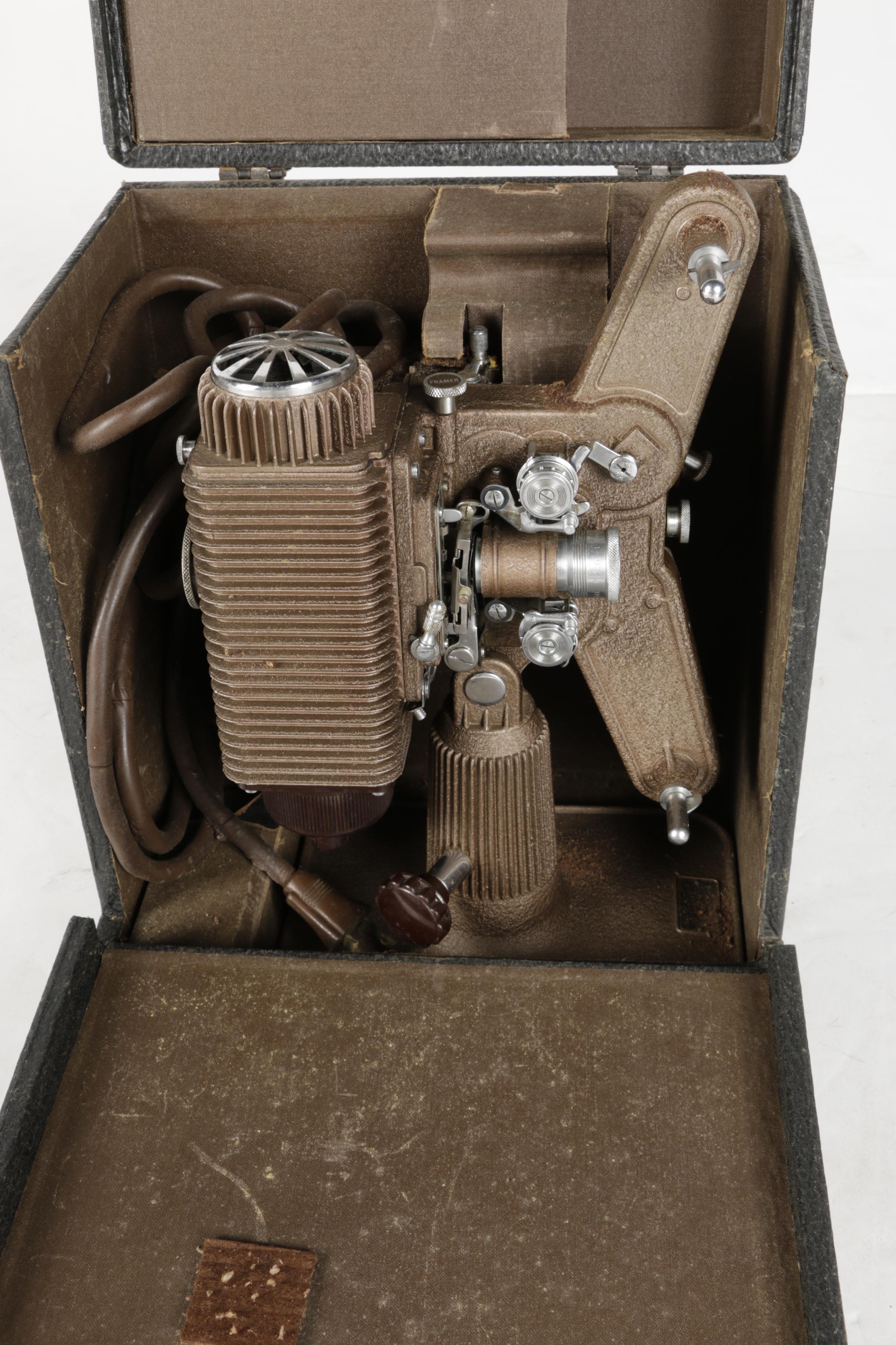 Four Vintage Projectors with Carrying Cases including Bell & Howell