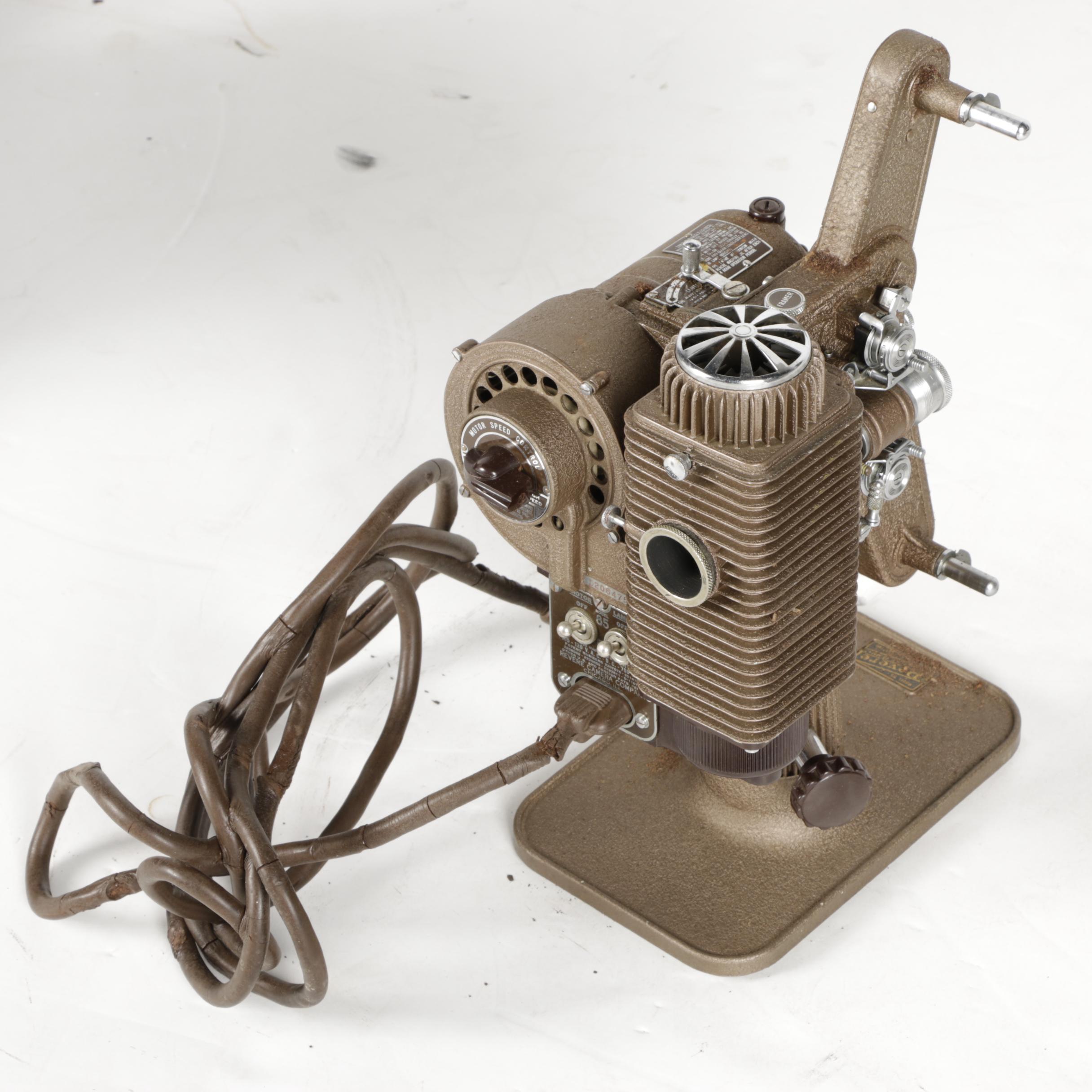 Four Vintage Projectors with Carrying Cases including Bell & Howell