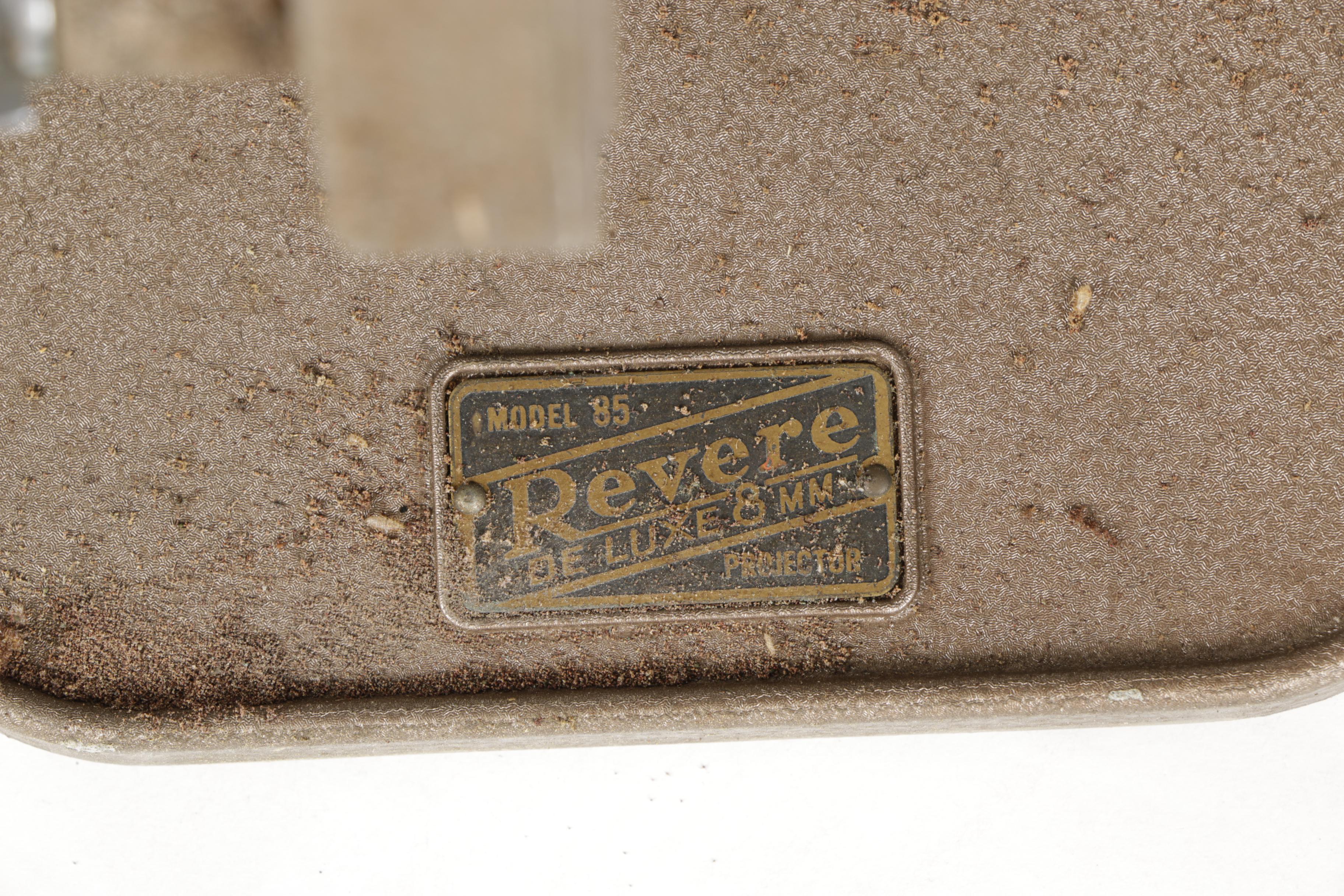 Four Vintage Projectors with Carrying Cases including Bell & Howell