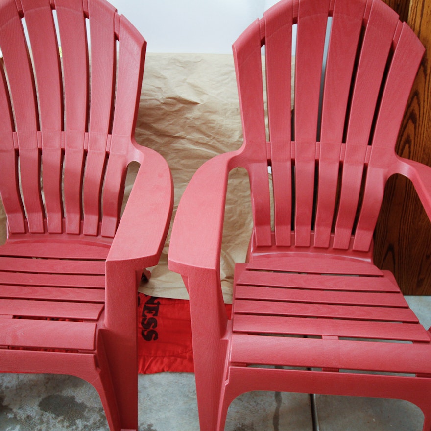 Pair of Red Plastic Adirondack Chairs