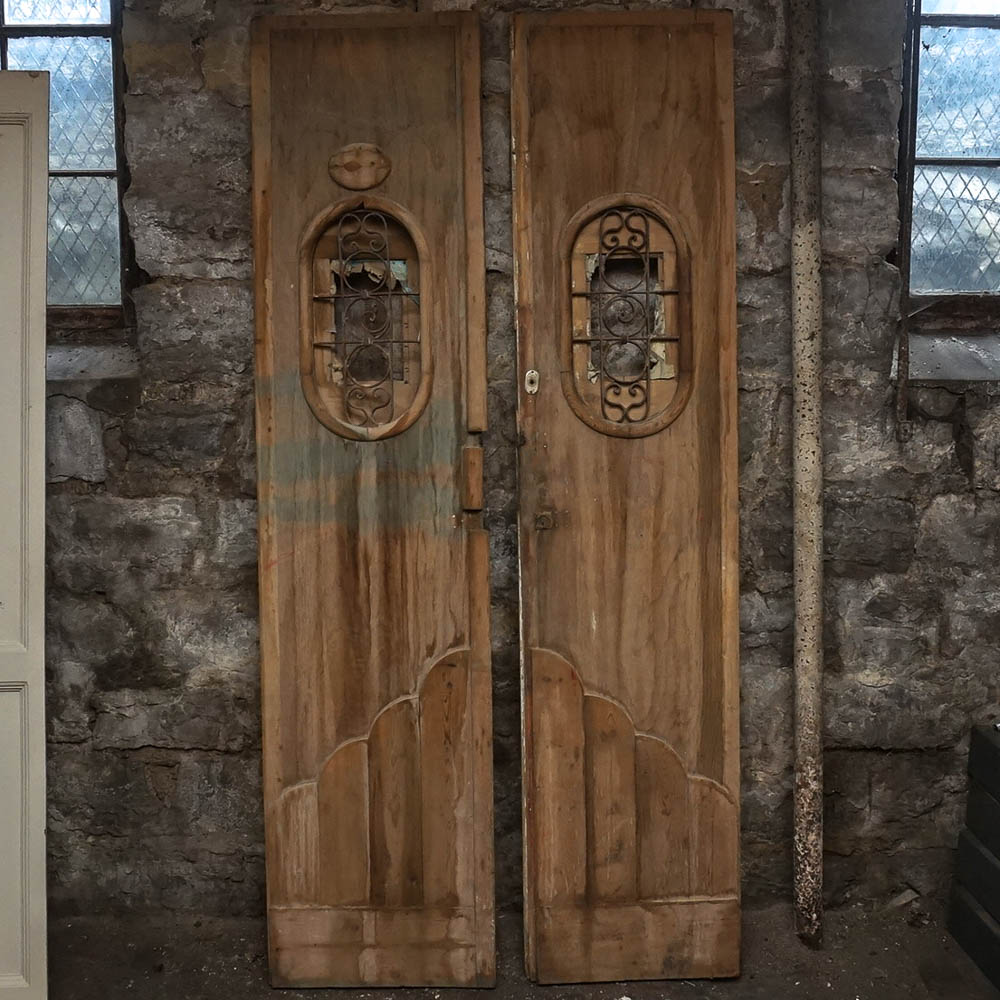 Egyptian-Style Doors With Decorative Iron Grates