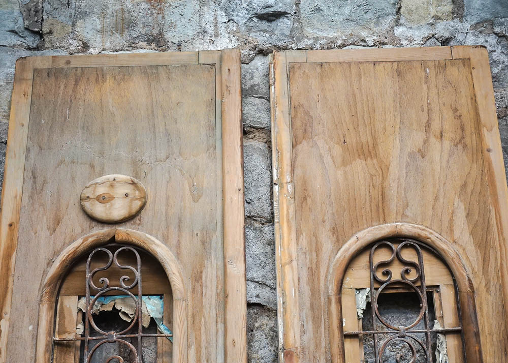 Egyptian-Style Doors With Decorative Iron Grates