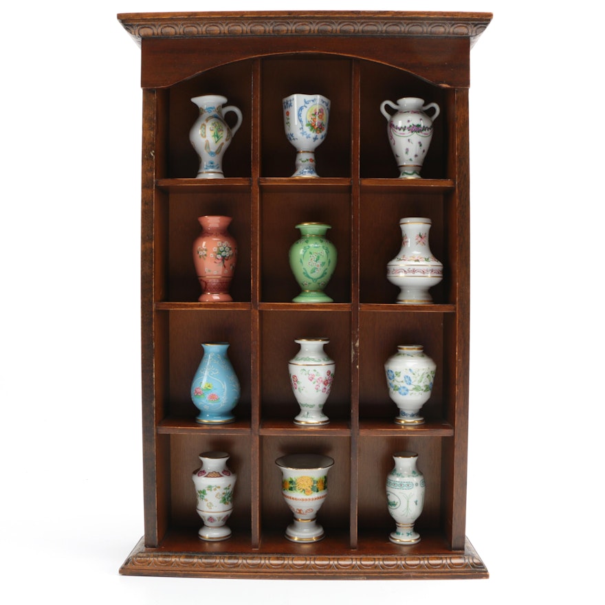 Collection of Twelve Japanese Porcelain Vases in Divided Display Shelf