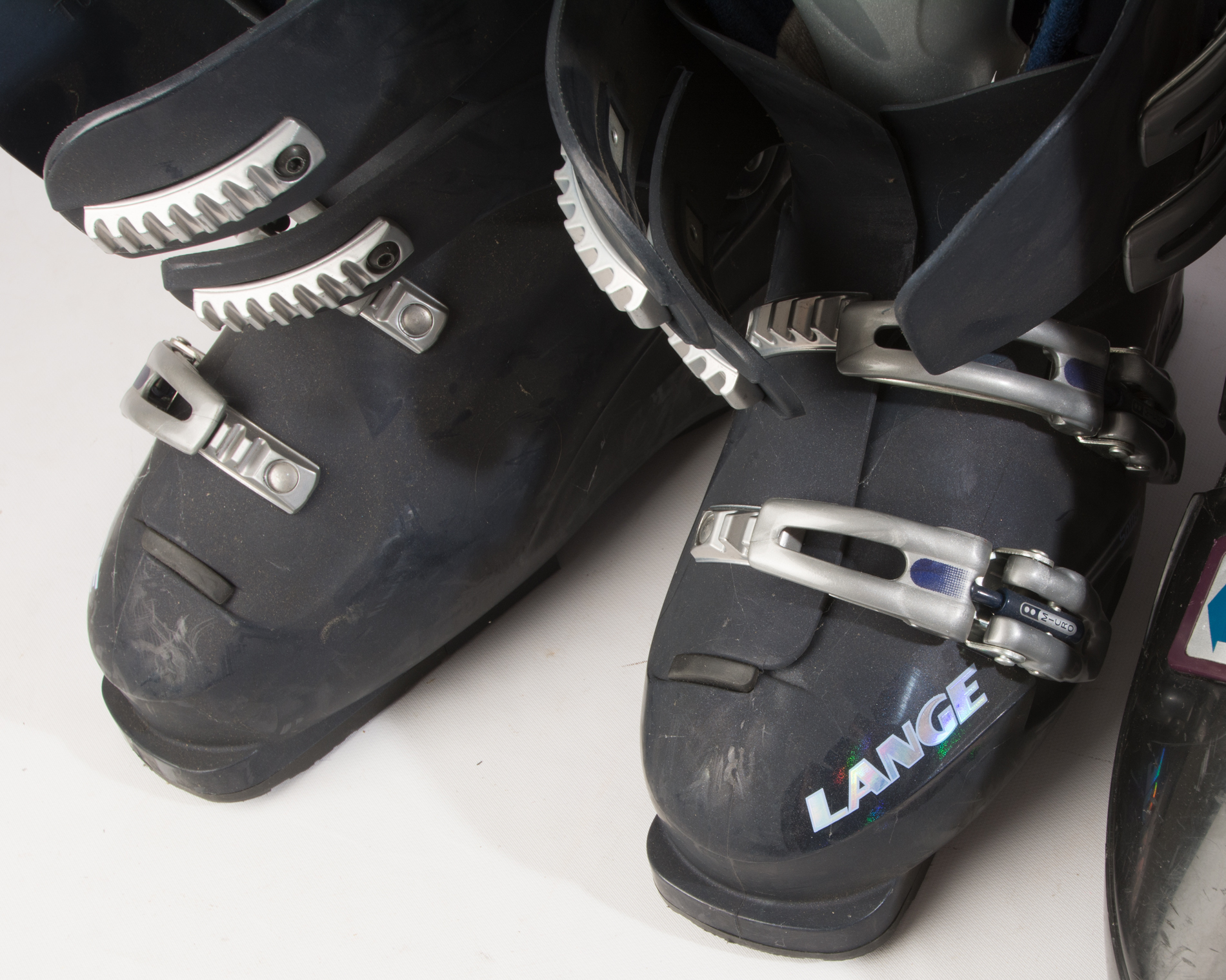 Three Pairs of Ski Boots featuring Rossignol