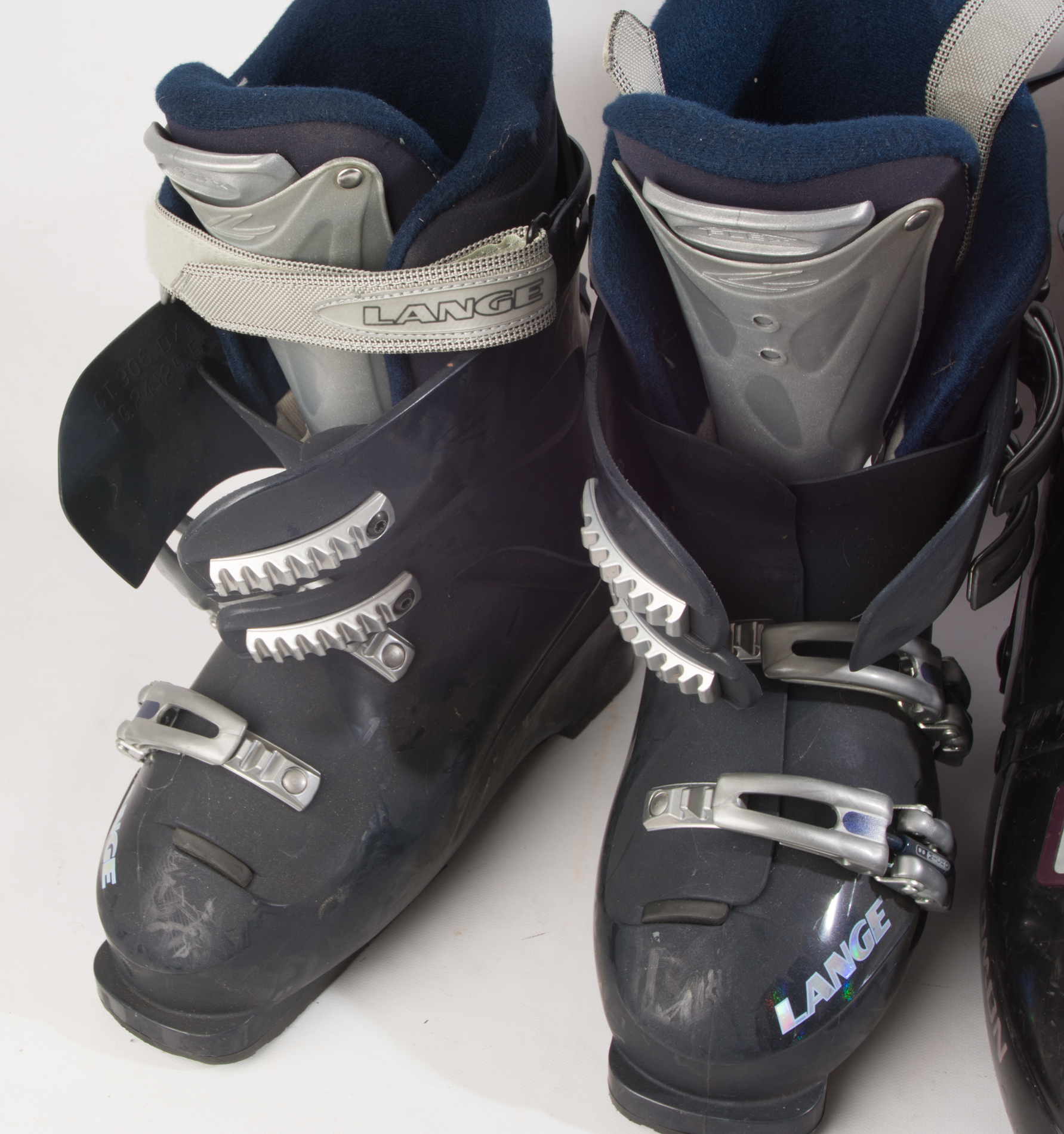 Three Pairs of Ski Boots featuring Rossignol