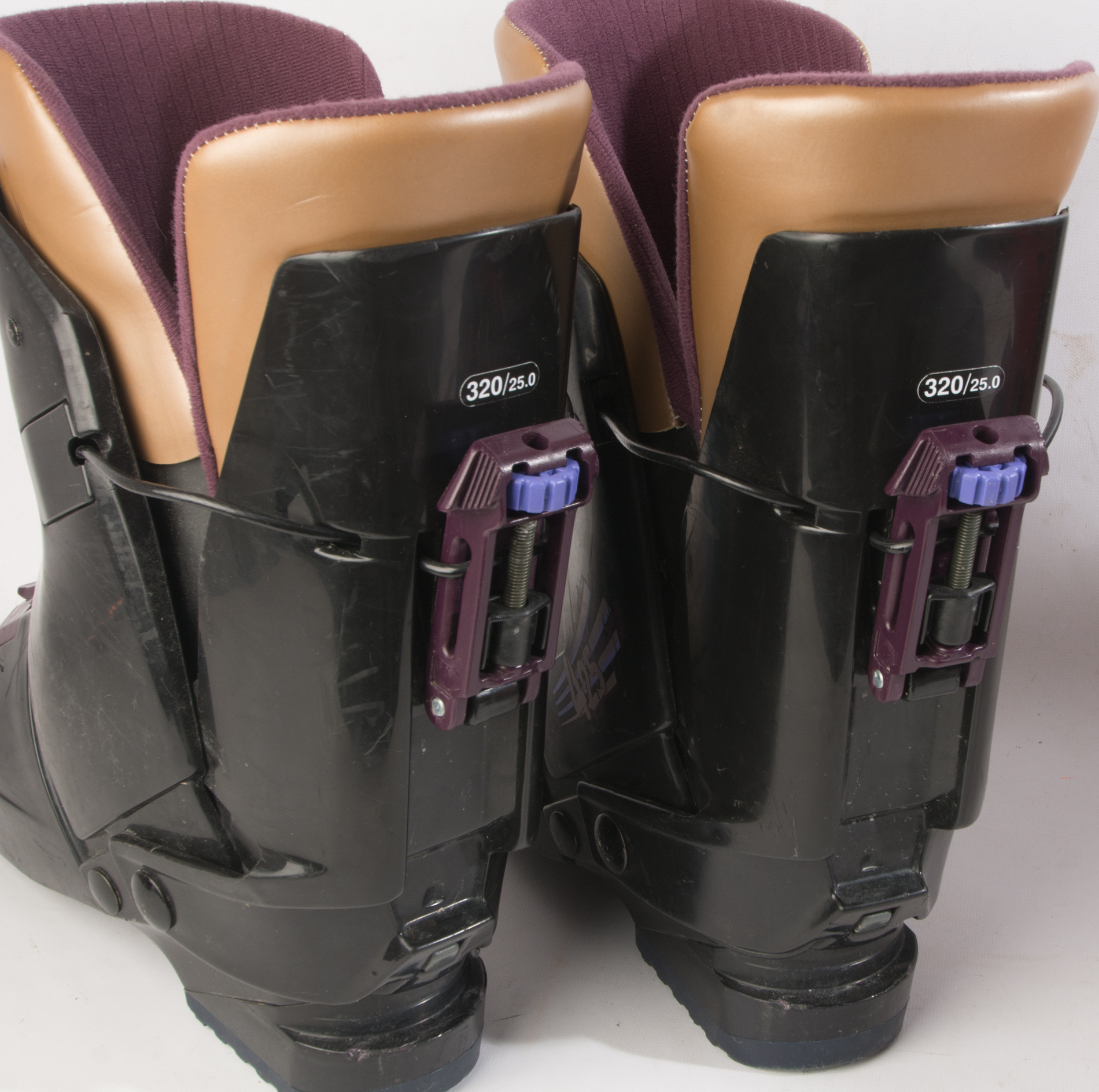 Three Pairs of Ski Boots featuring Rossignol