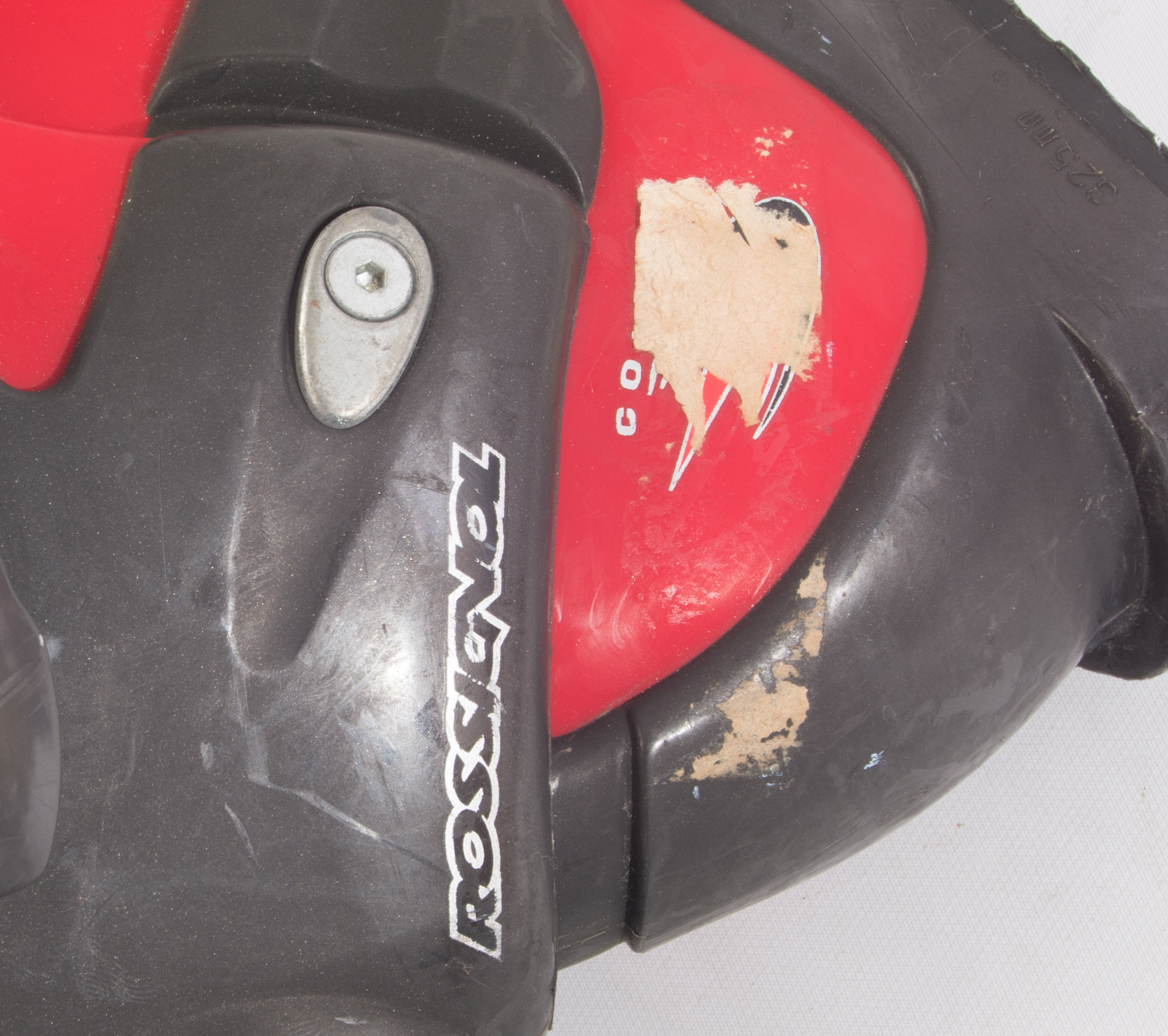 Three Pairs of Ski Boots featuring Rossignol