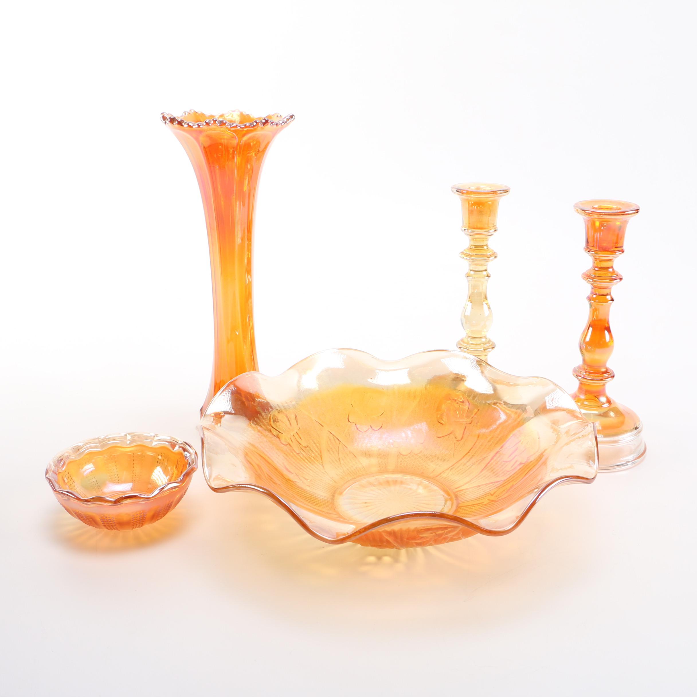 amber glass vase, tray, and candle holders