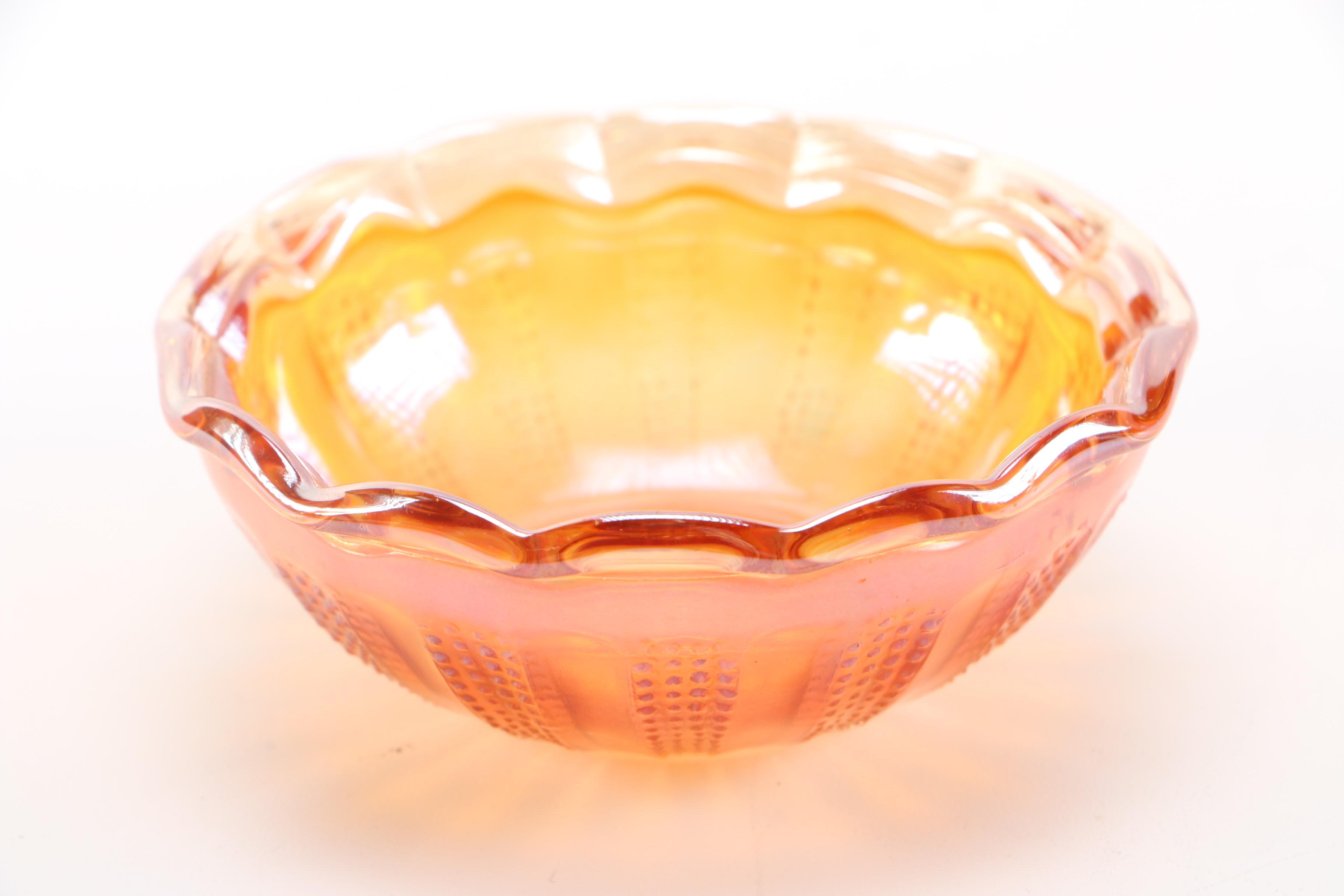 amber glass vase, tray, and candle holders