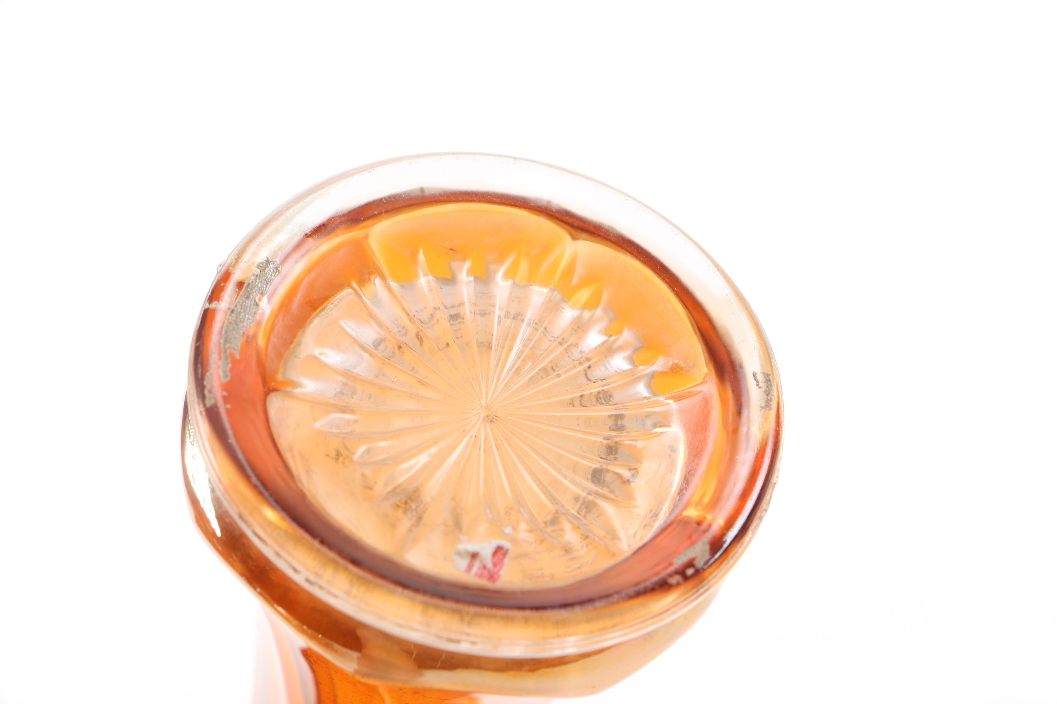 amber glass vase, tray, and candle holders