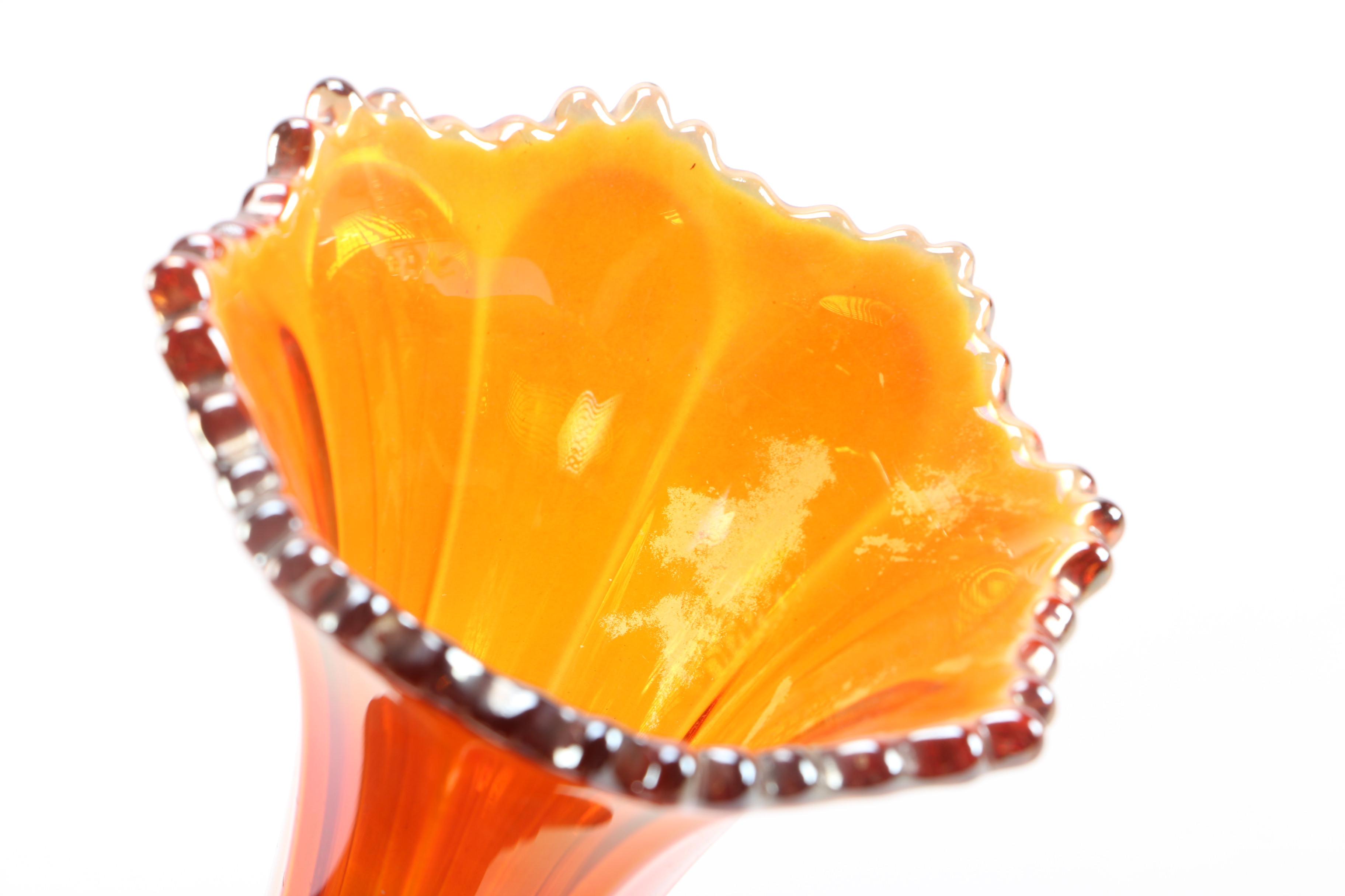 amber glass vase, tray, and candle holders