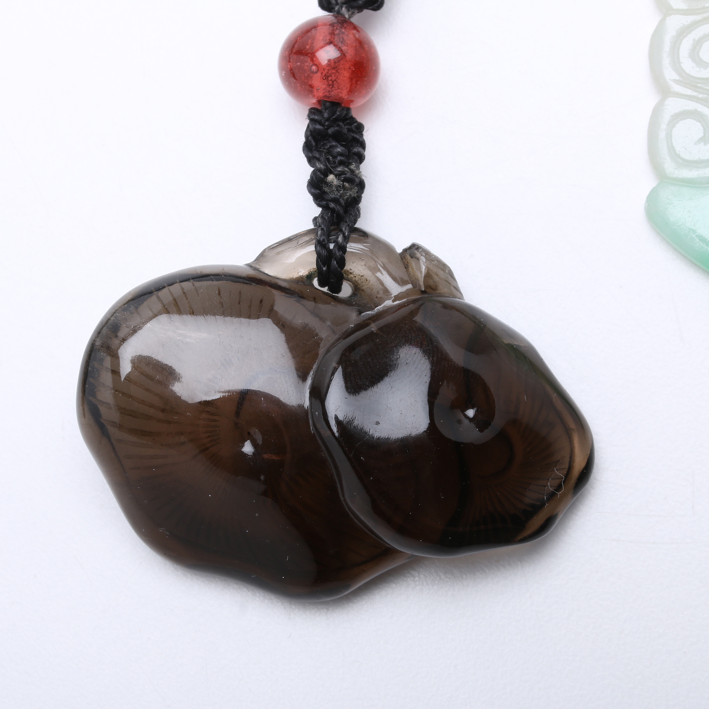 Two Carved Pendants on Knotted Silk Cords, Smoky Quartz & Jadeite