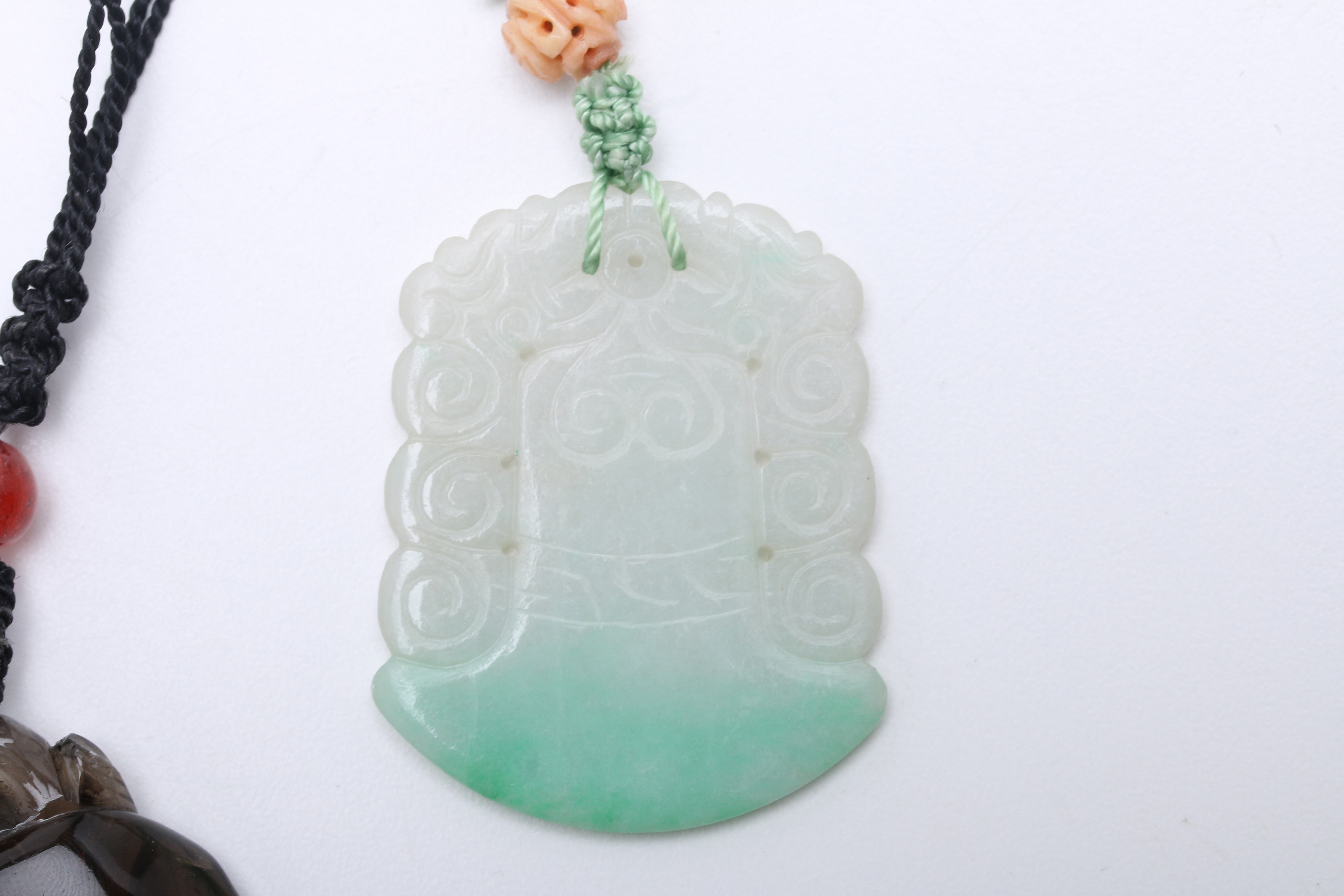 Two Carved Pendants on Knotted Silk Cords, Smoky Quartz & Jadeite