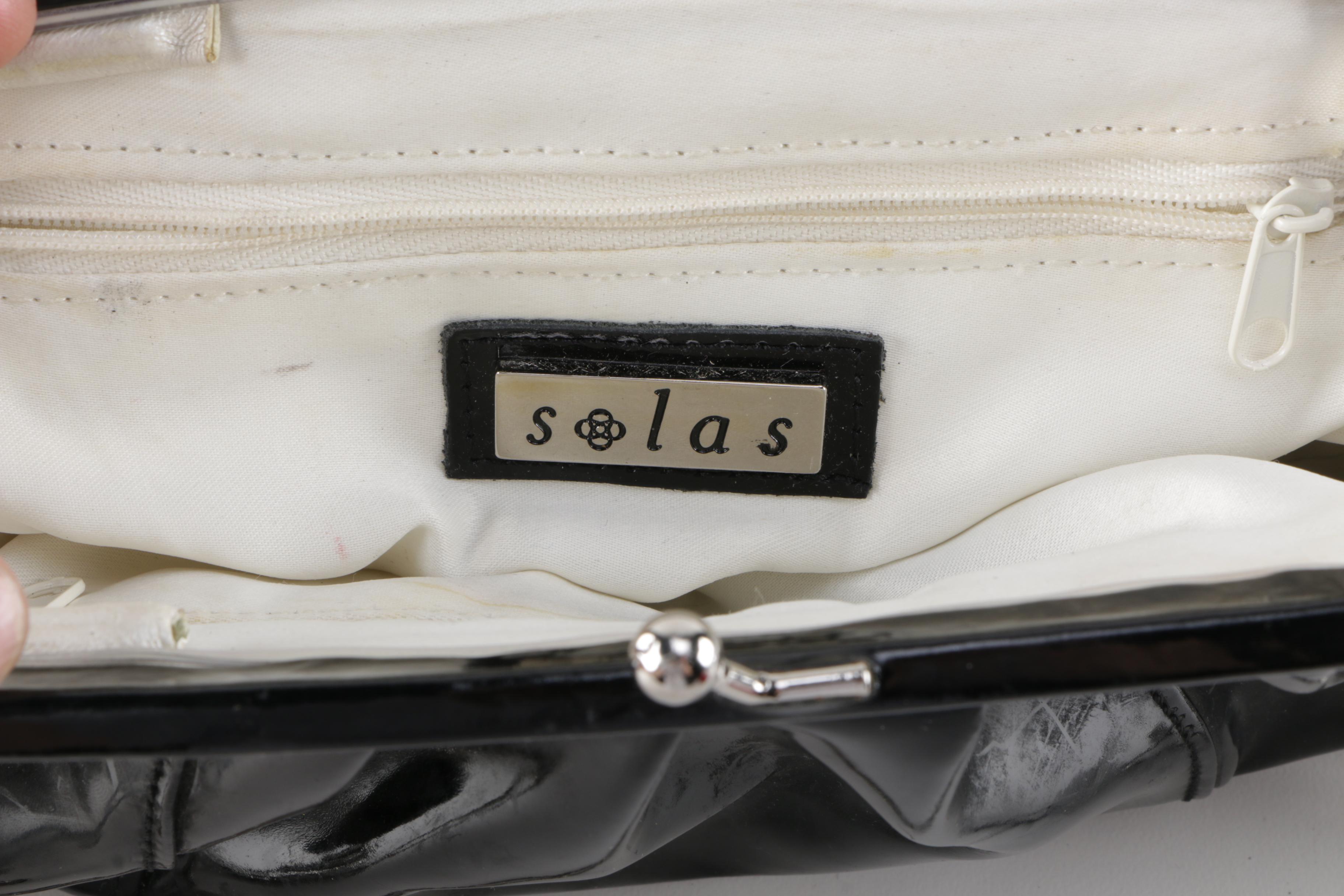 Pair of Solas Patent Leather Clutch Bags with light inside