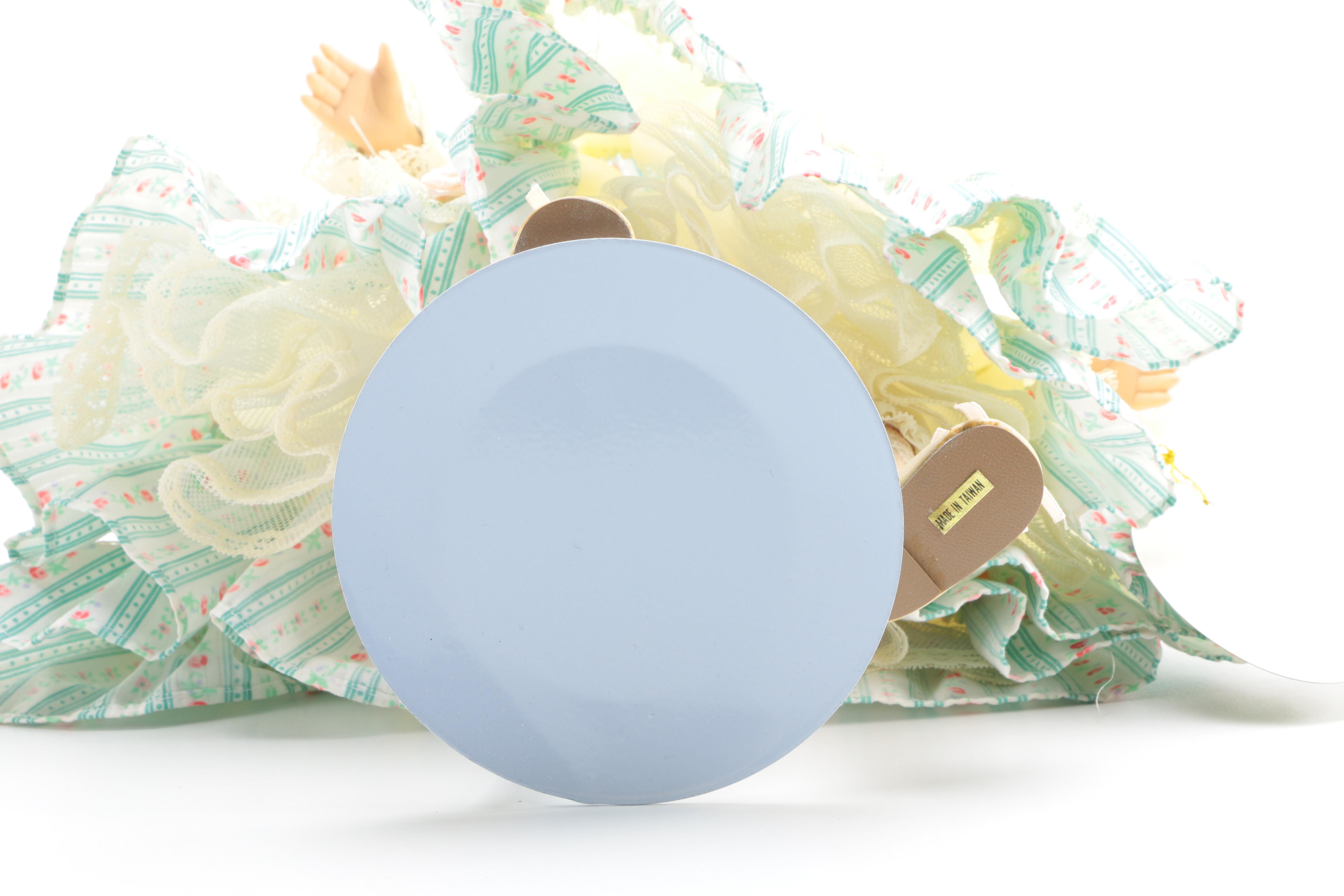 Pair of Porcelain Dolls