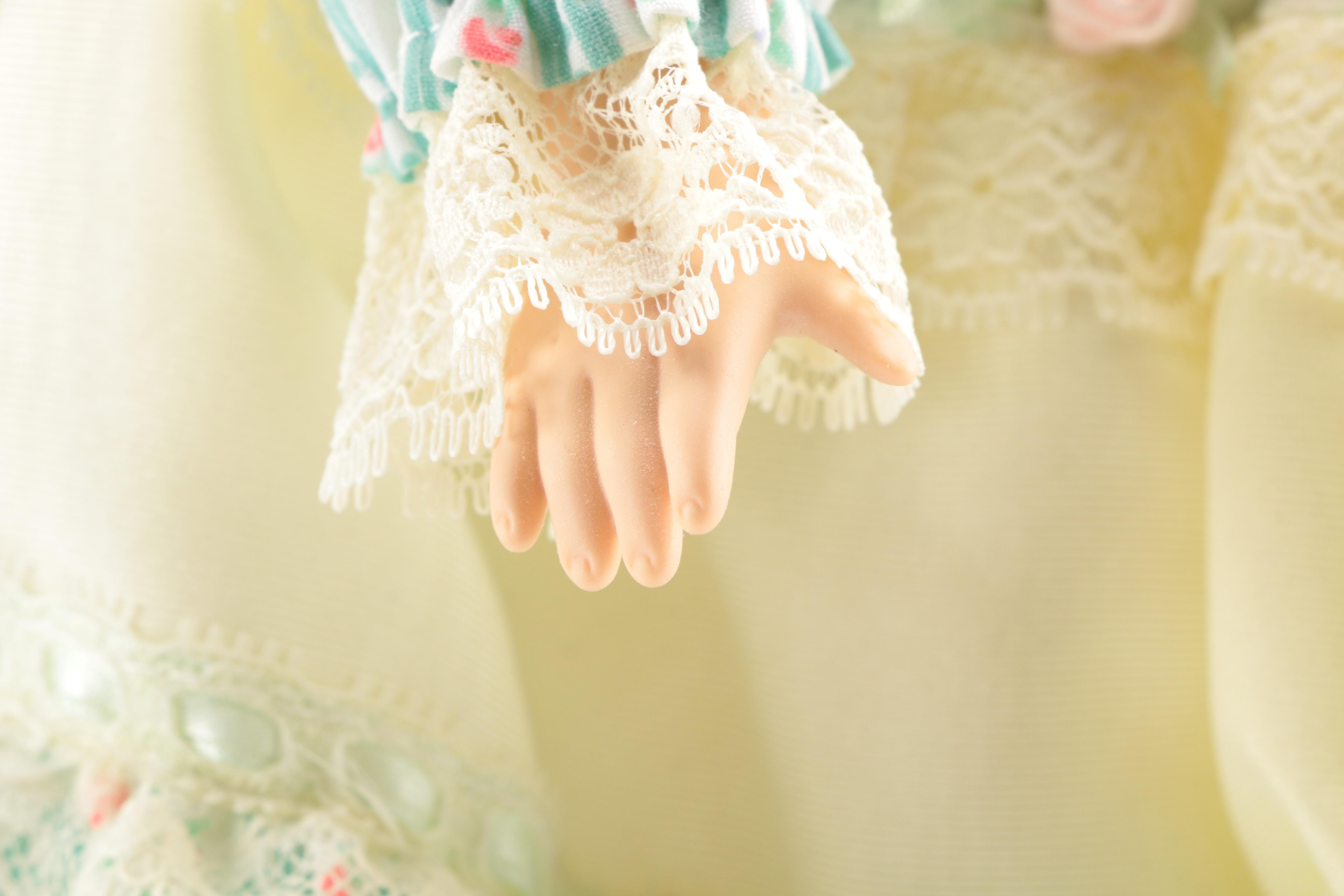 Pair of Porcelain Dolls