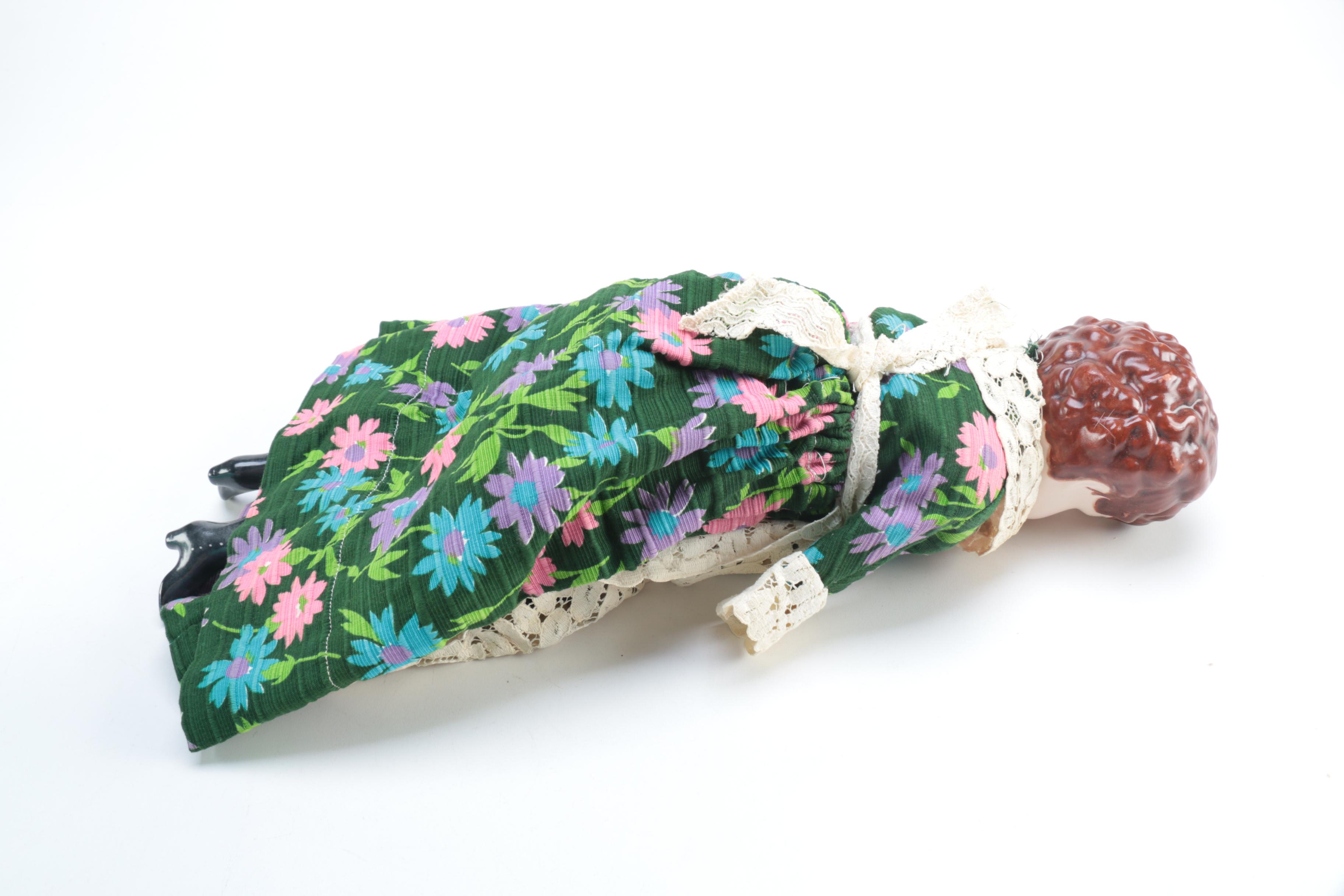 Porcelain Doll with Religious Books and Tin Container