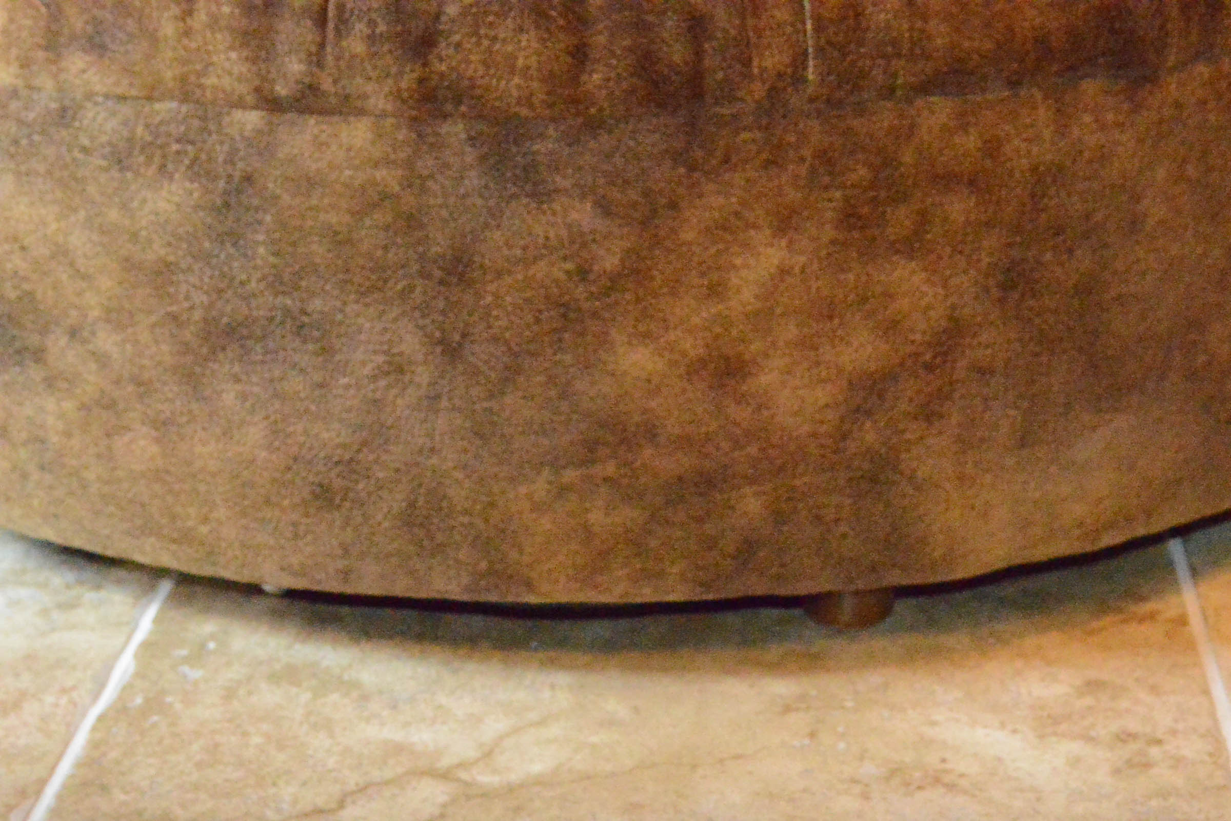 Round Tufted Brown Ottoman