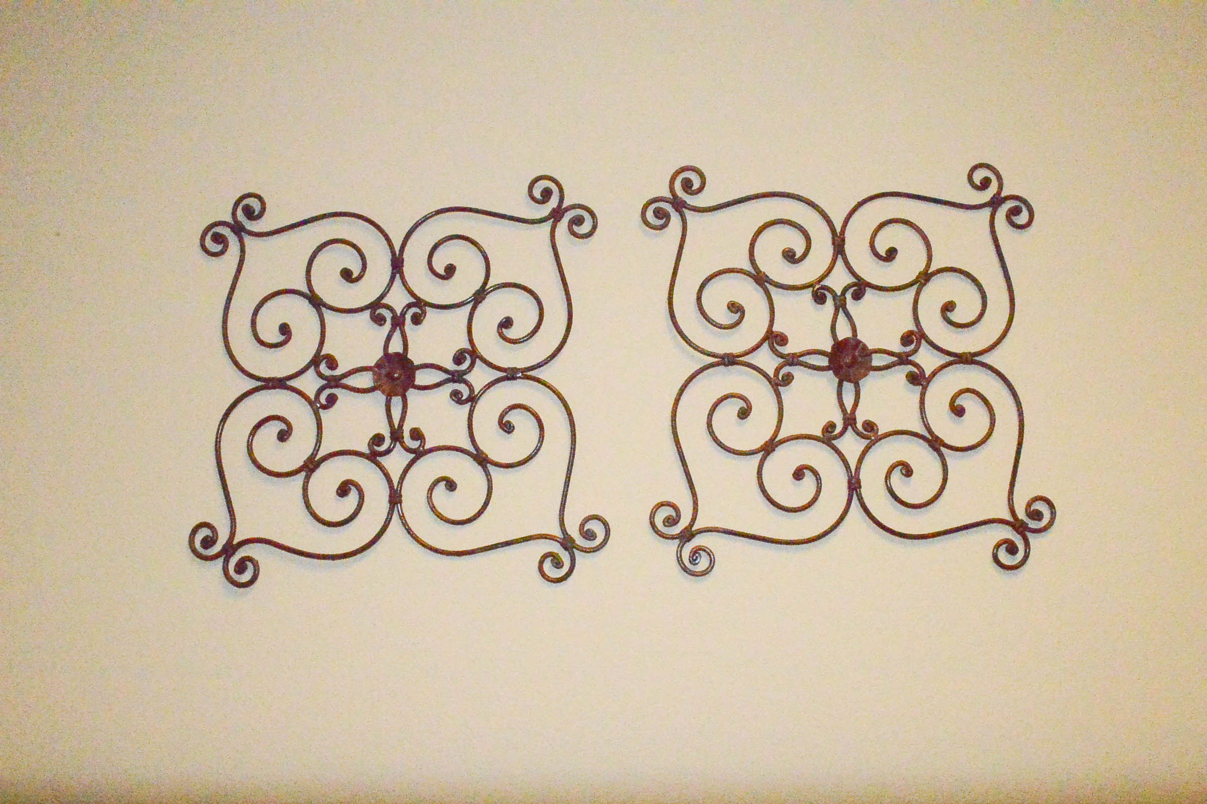 Pair of Wrought Metal Wall Hangings