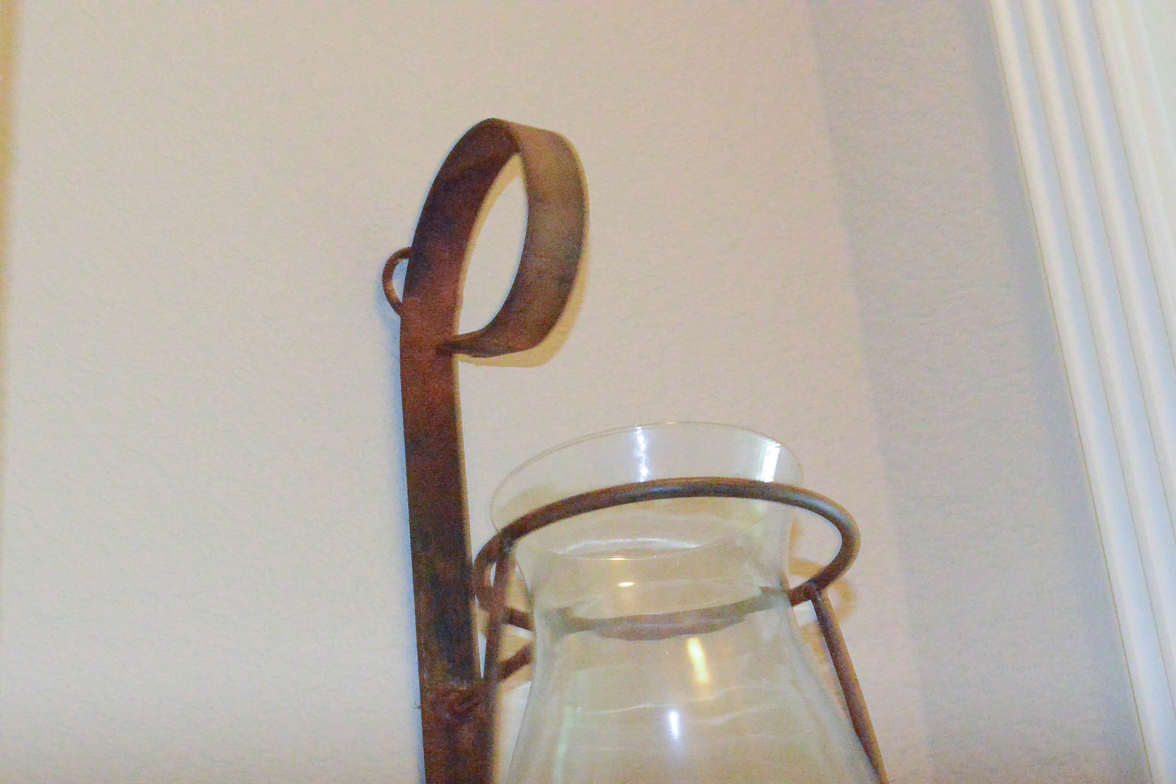 Pair of Large Wrought Metal and Glass Wall Sconces