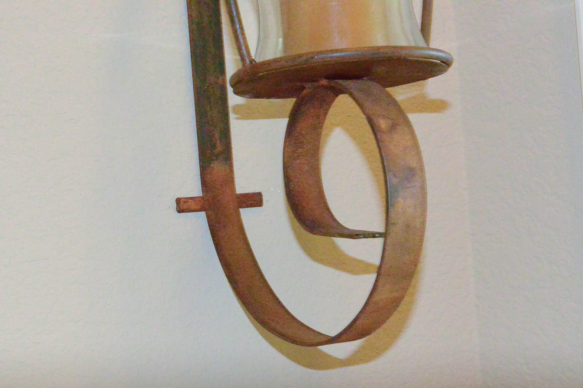 Pair of Large Wrought Metal and Glass Wall Sconces