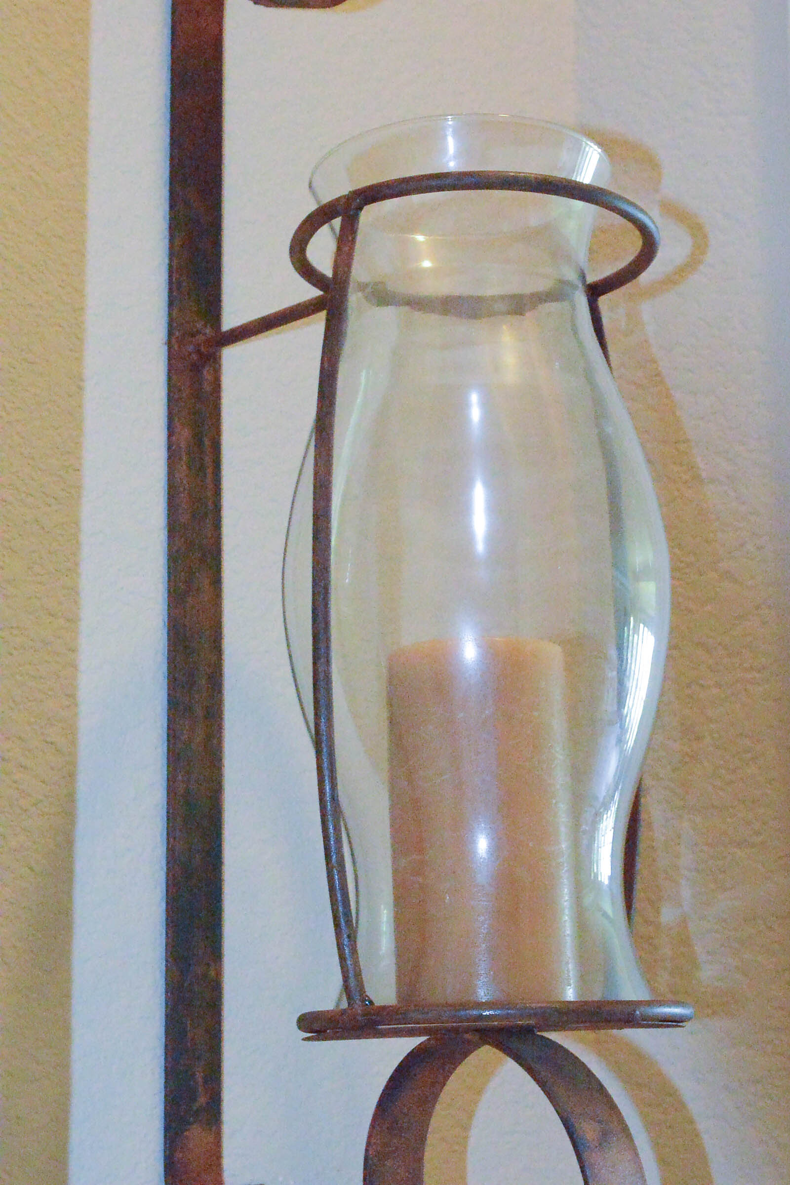 Pair of Large Wrought Metal and Glass Wall Sconces