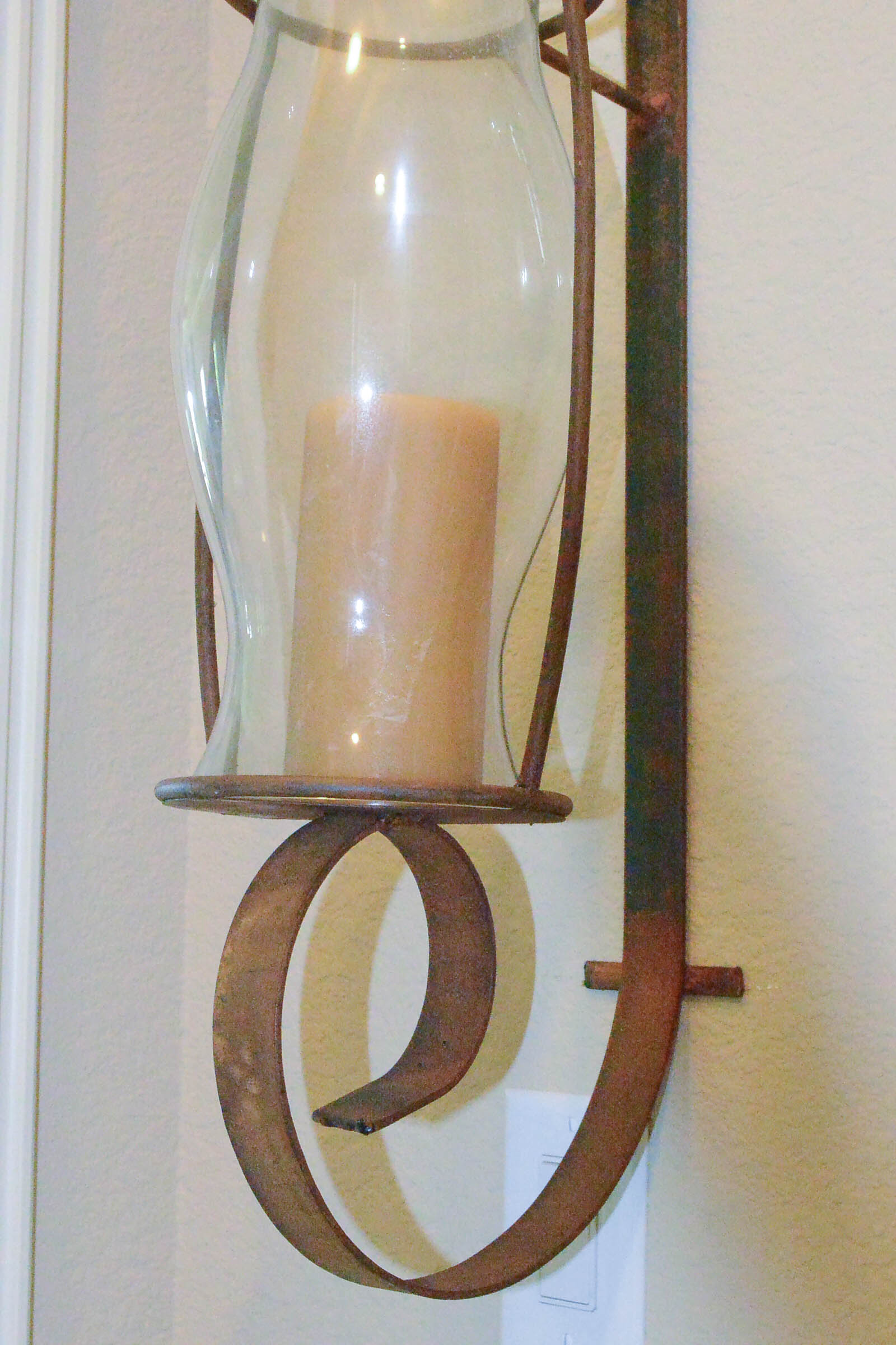 Pair of Large Wrought Metal and Glass Wall Sconces
