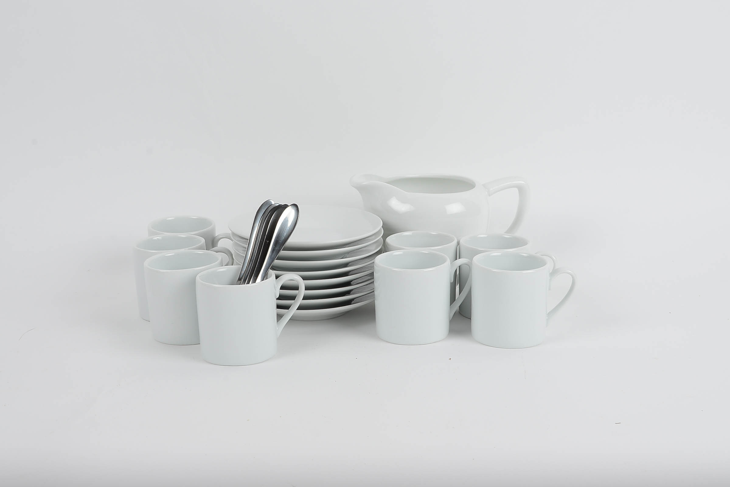 Set of Eight White Glazed Demitasse Cups and Saucers