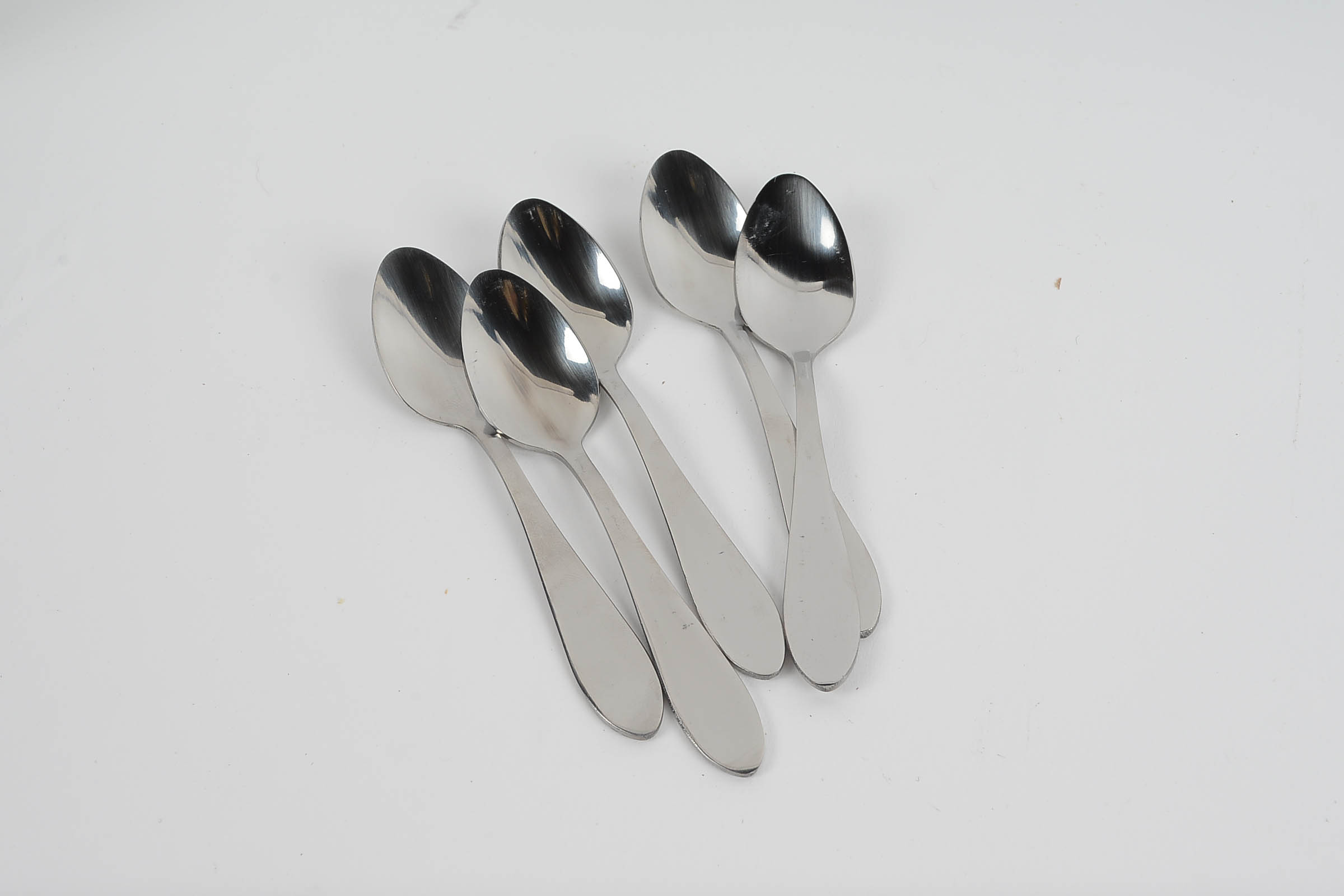 Set of Eight White Glazed Demitasse Cups and Saucers