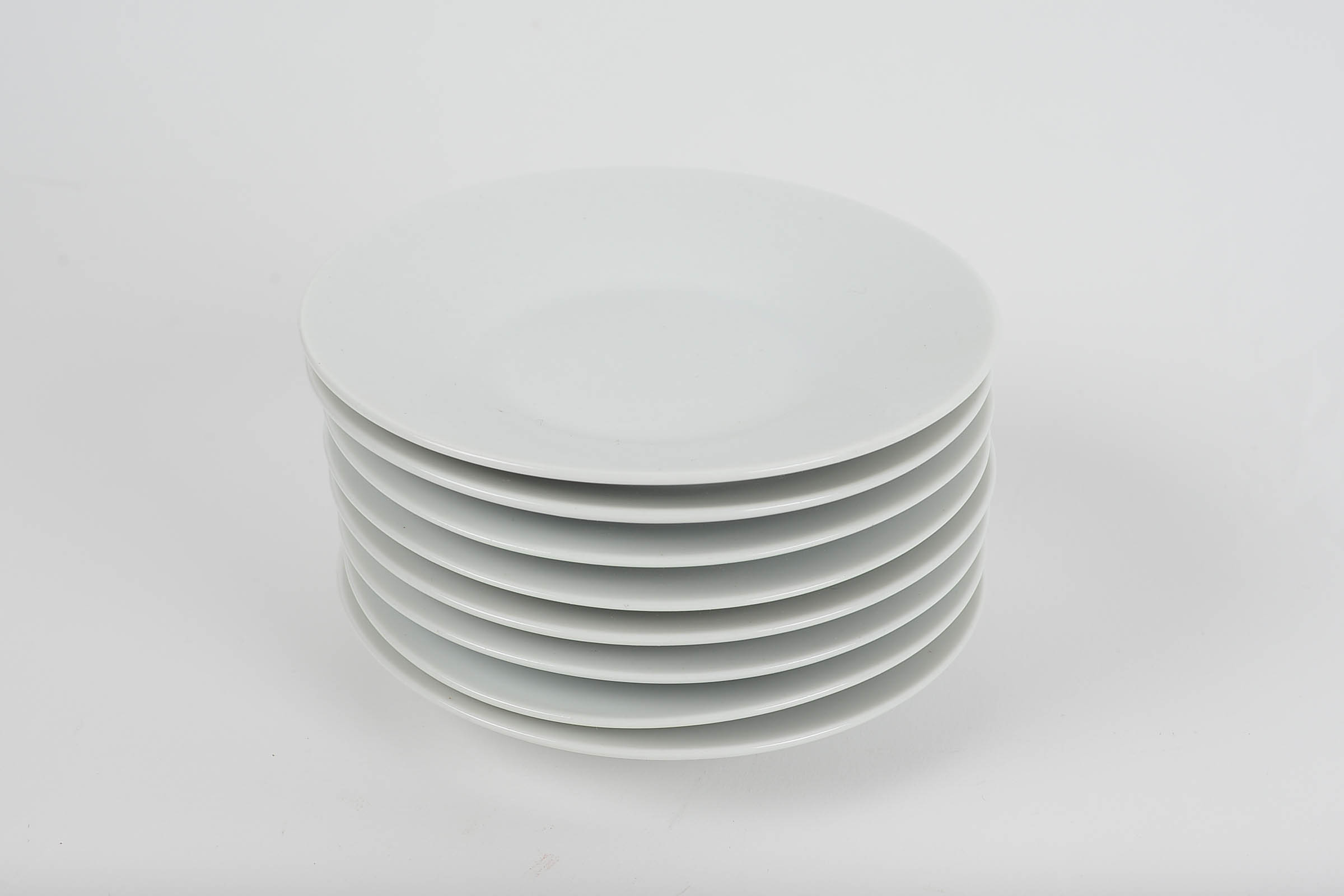 Set of Eight White Glazed Demitasse Cups and Saucers