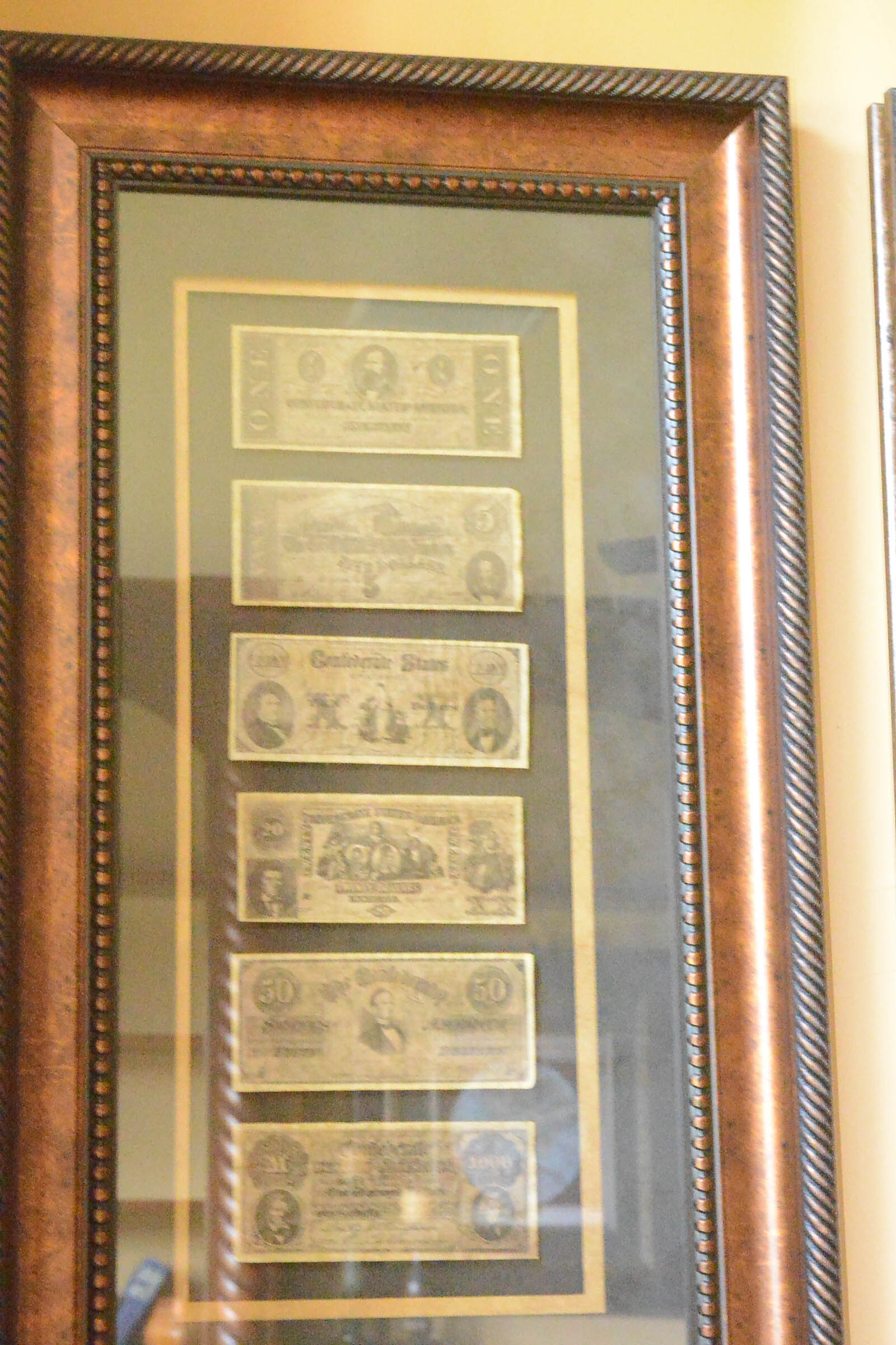 Two Framed Pieces of Monetary Wall Decor