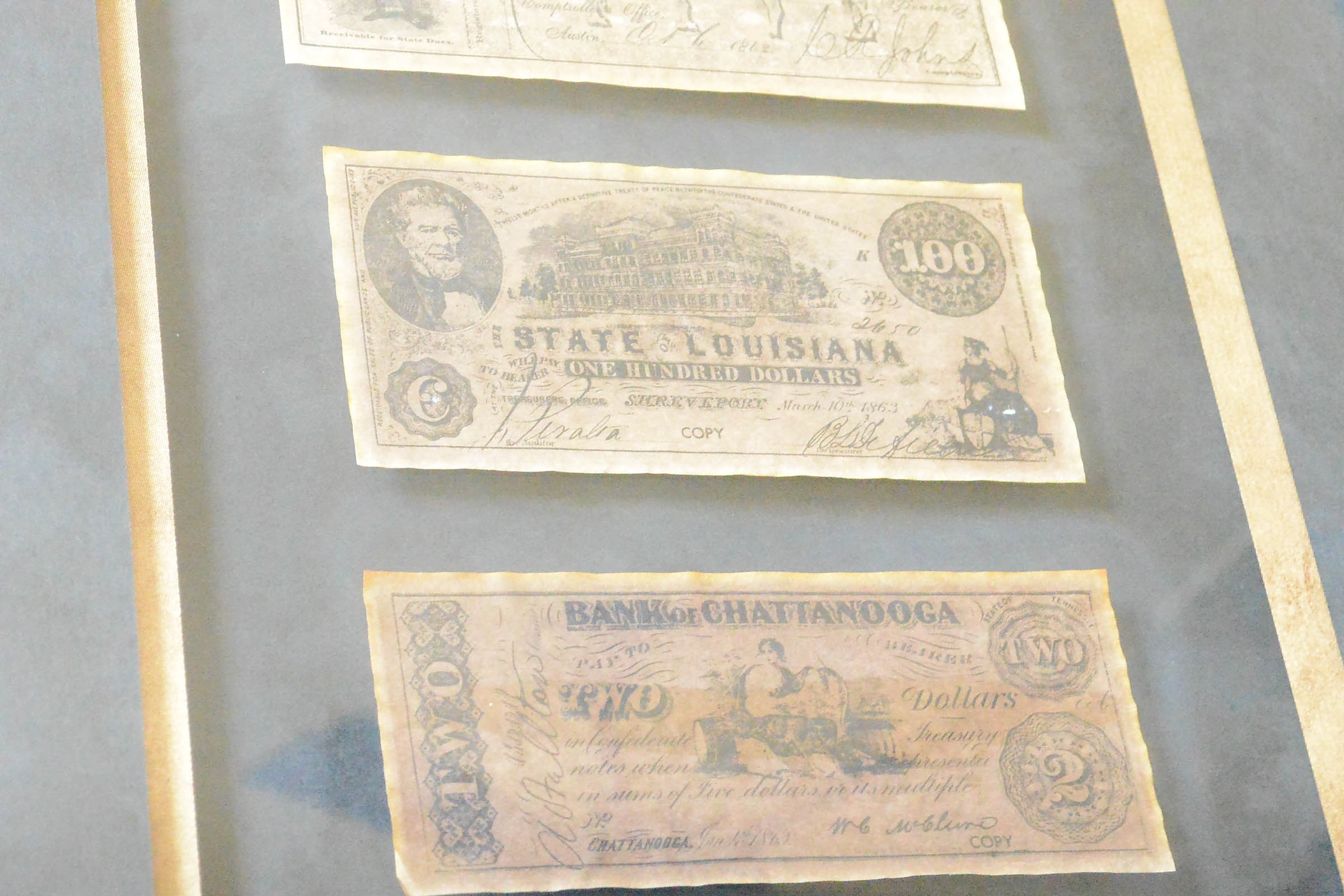 Two Framed Pieces of Monetary Wall Decor