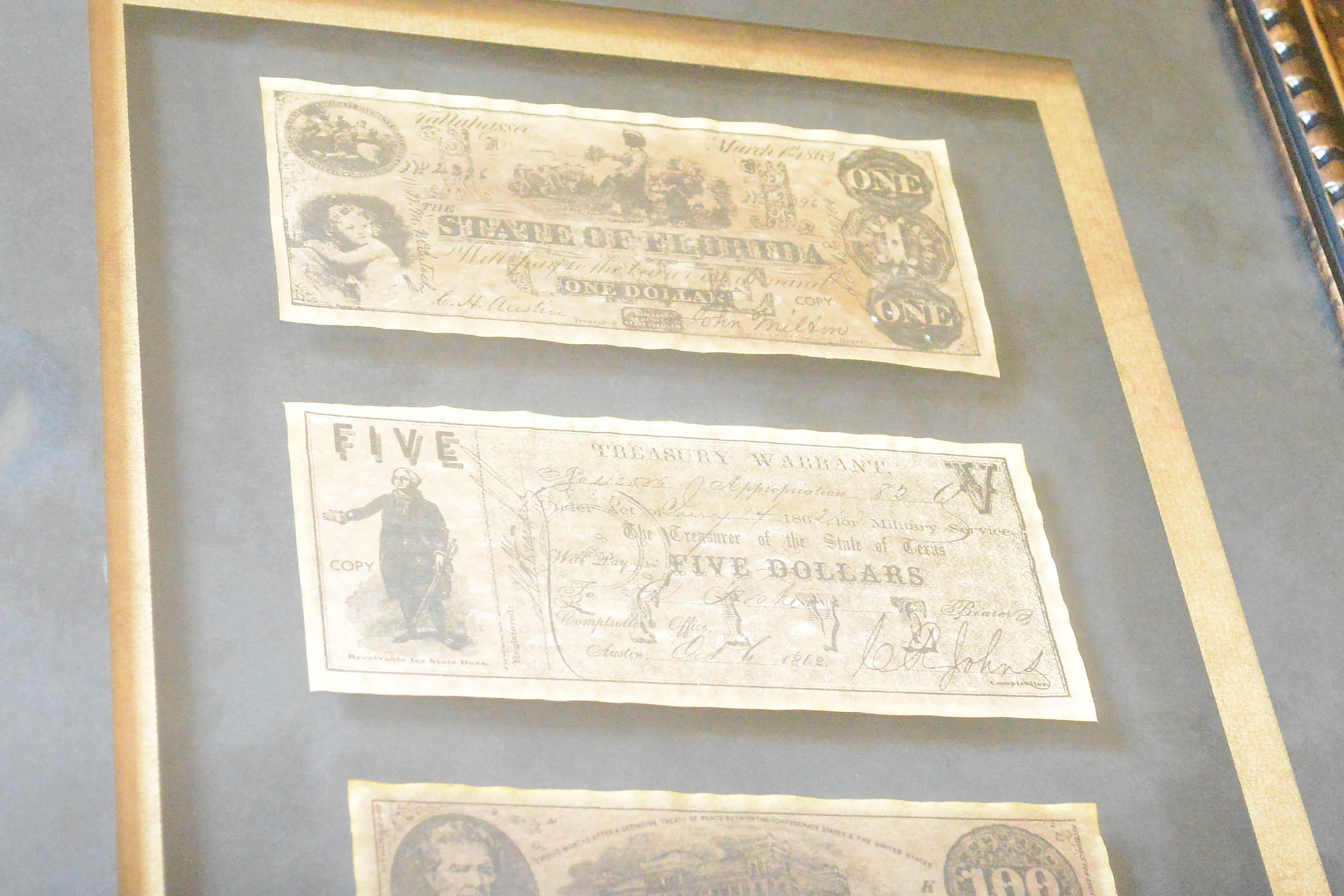 Two Framed Pieces of Monetary Wall Decor