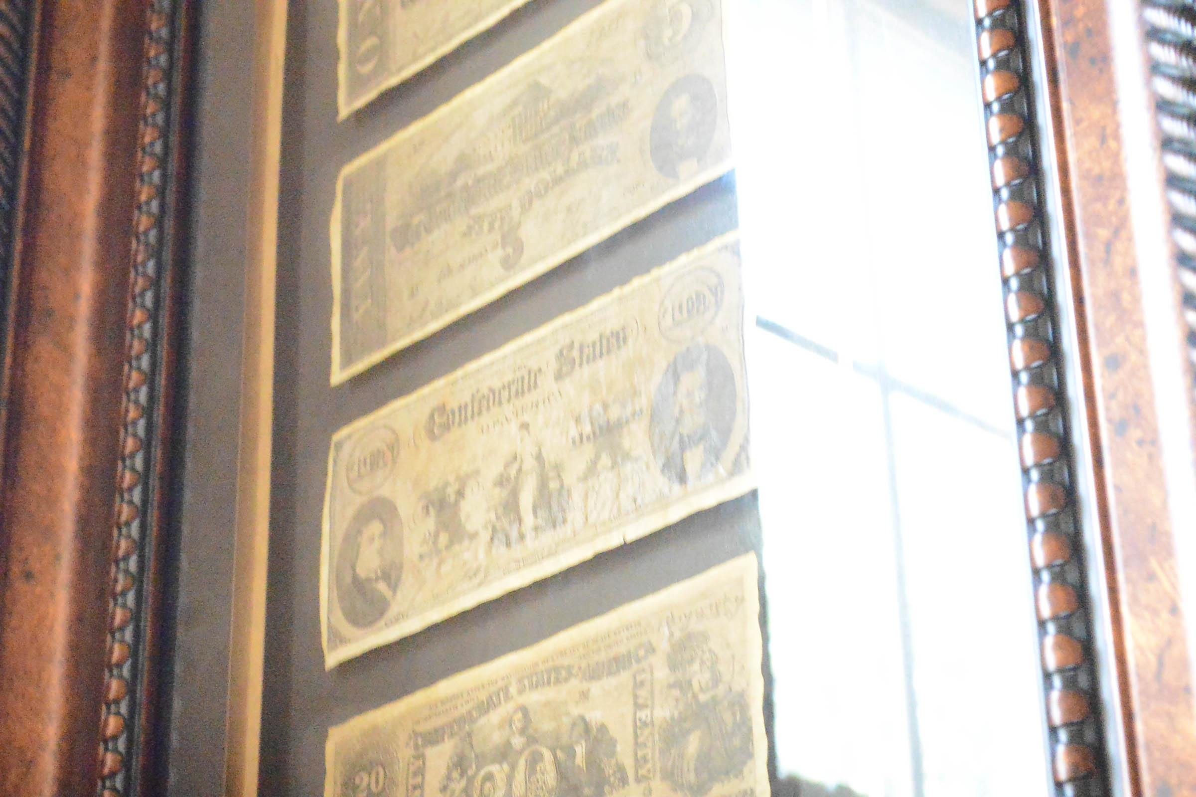 Two Framed Pieces of Monetary Wall Decor