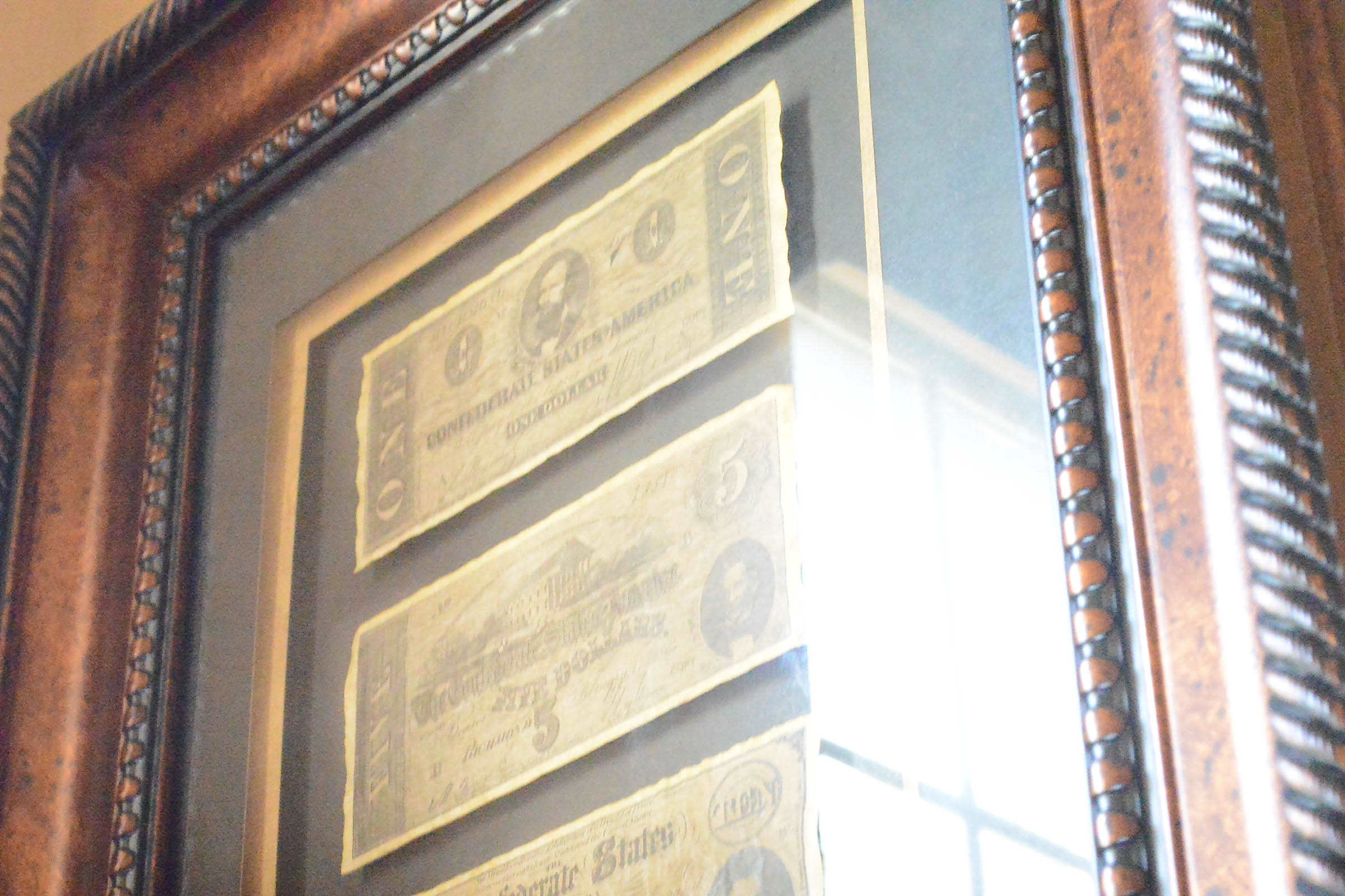 Two Framed Pieces of Monetary Wall Decor