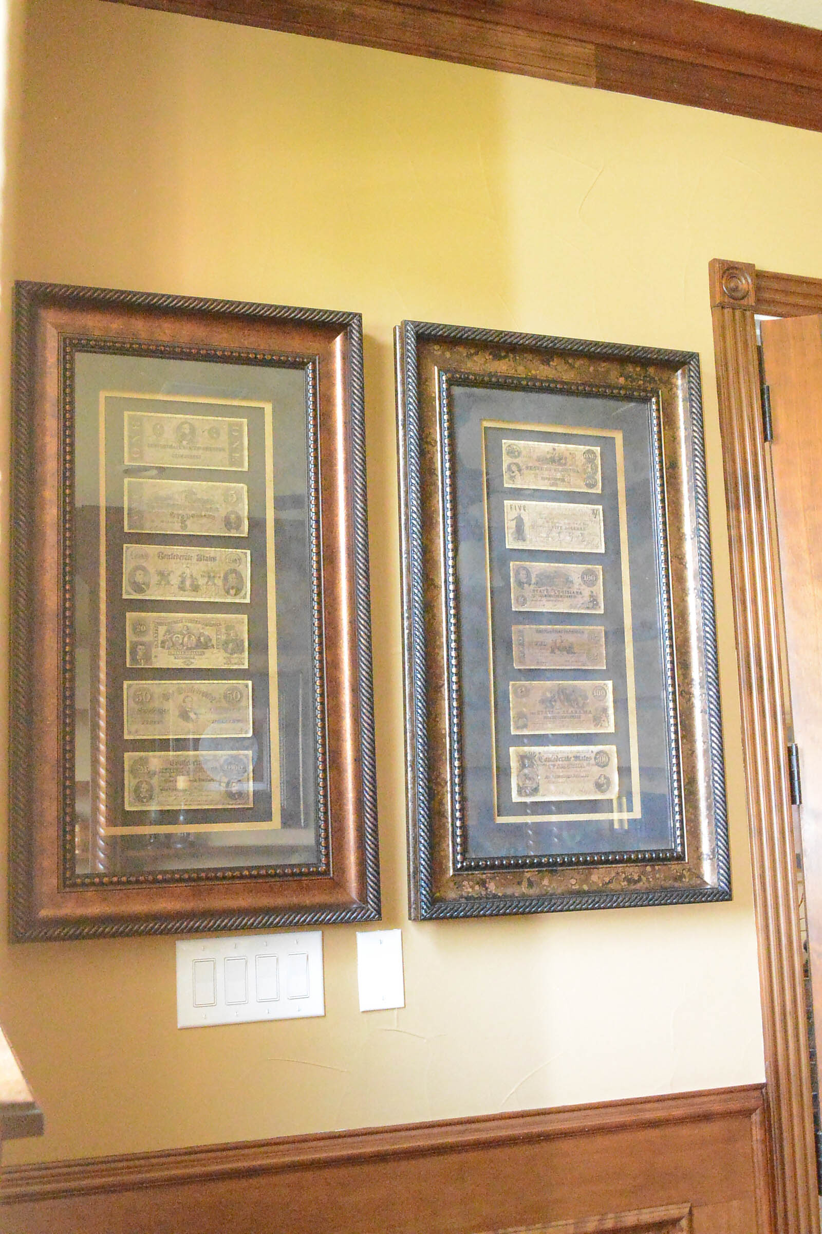 Two Framed Pieces of Monetary Wall Decor