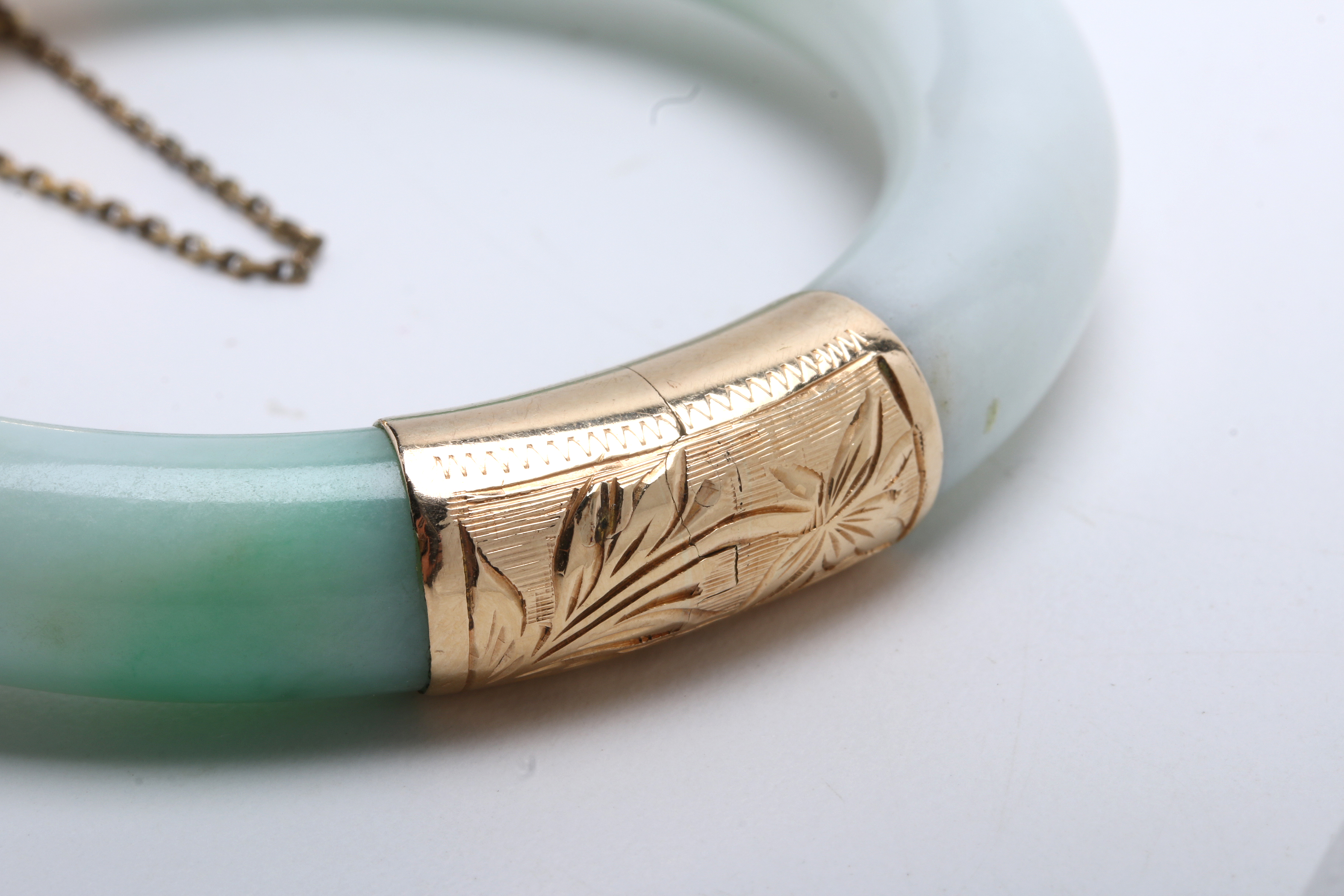 Jadeite Bracelet with 14K Yellow Gold Bands at Hinge and Clasp