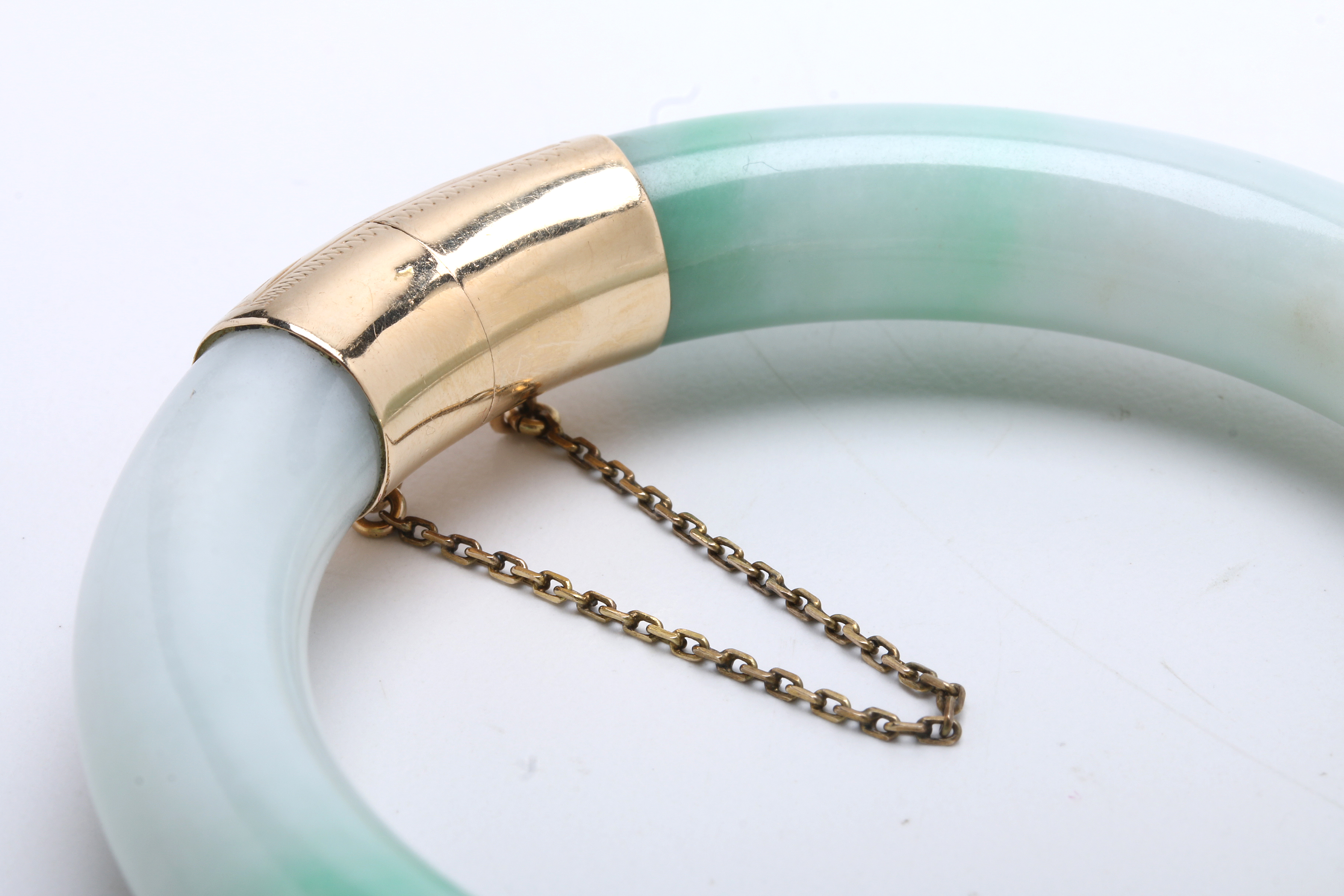 Jadeite Bracelet with 14K Yellow Gold Bands at Hinge and Clasp