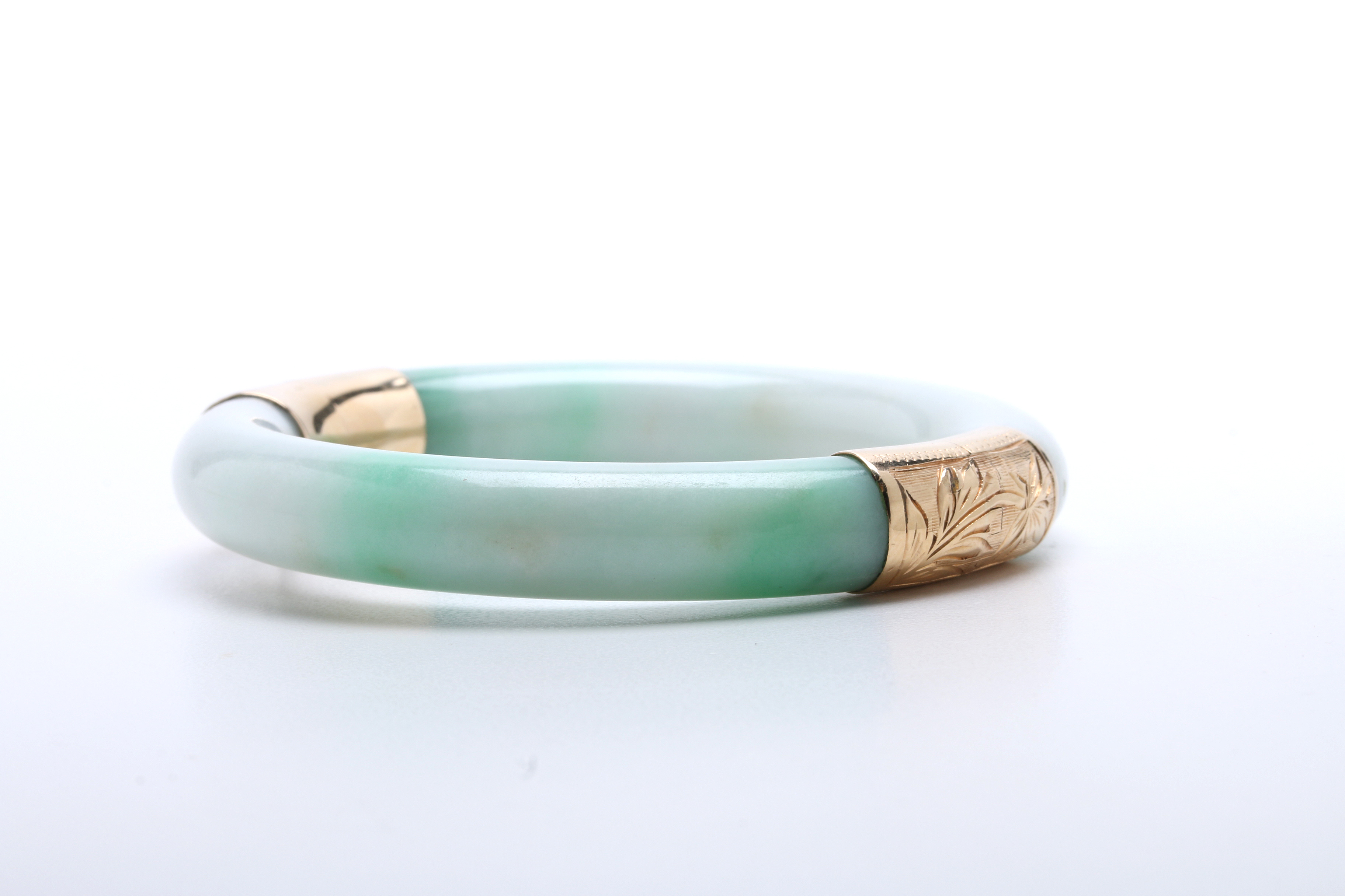 Jadeite Bracelet with 14K Yellow Gold Bands at Hinge and Clasp